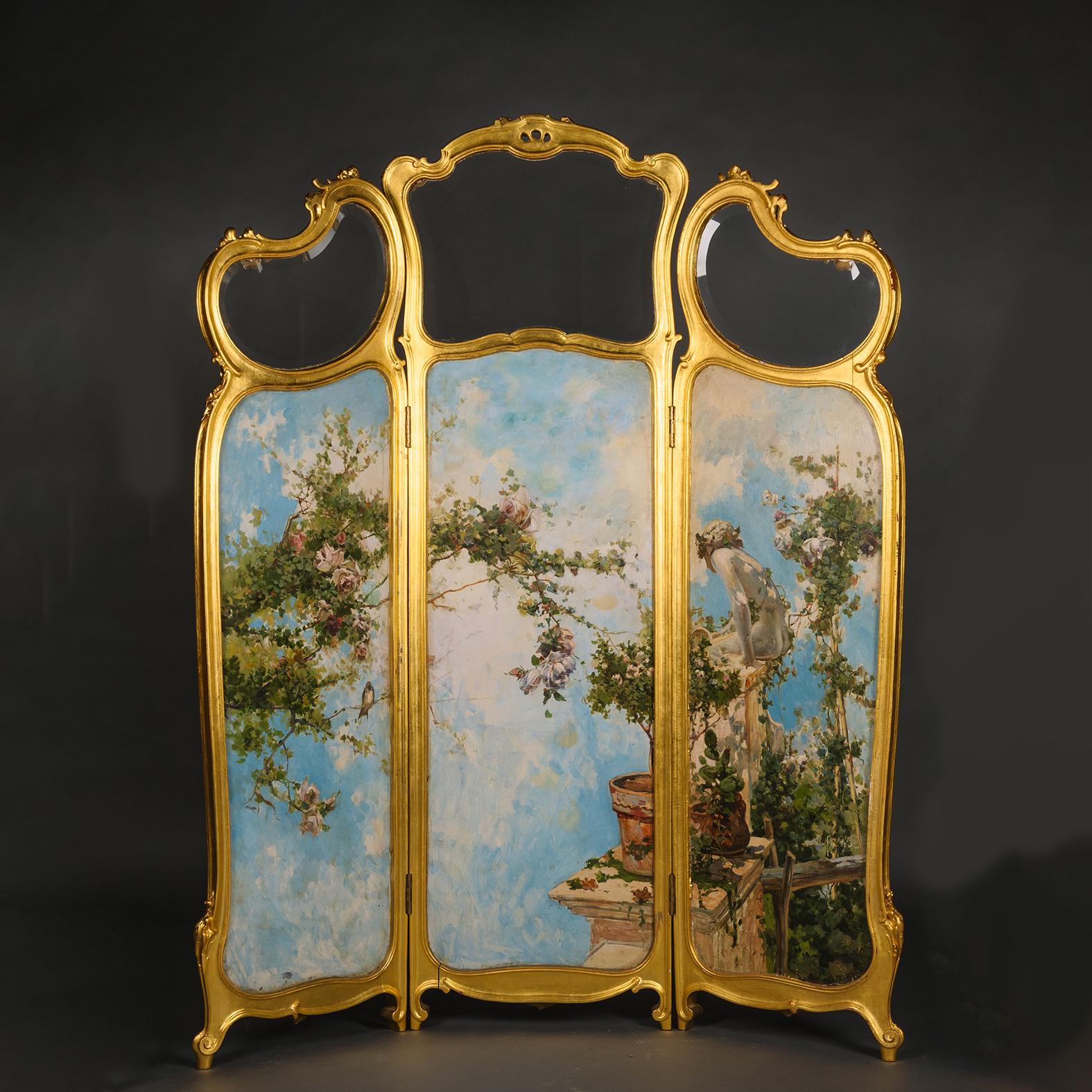 A Fine Louis XV Style Giltwood and Oil on Panel Three-Panelled Screen, Painted By Juderías Caballero (Spanish, 1867-1951). 

Signed 'J. Caballero. Paris'.

The giltwood frame enclosing three panes of bevelled glass above three painted panels, on one