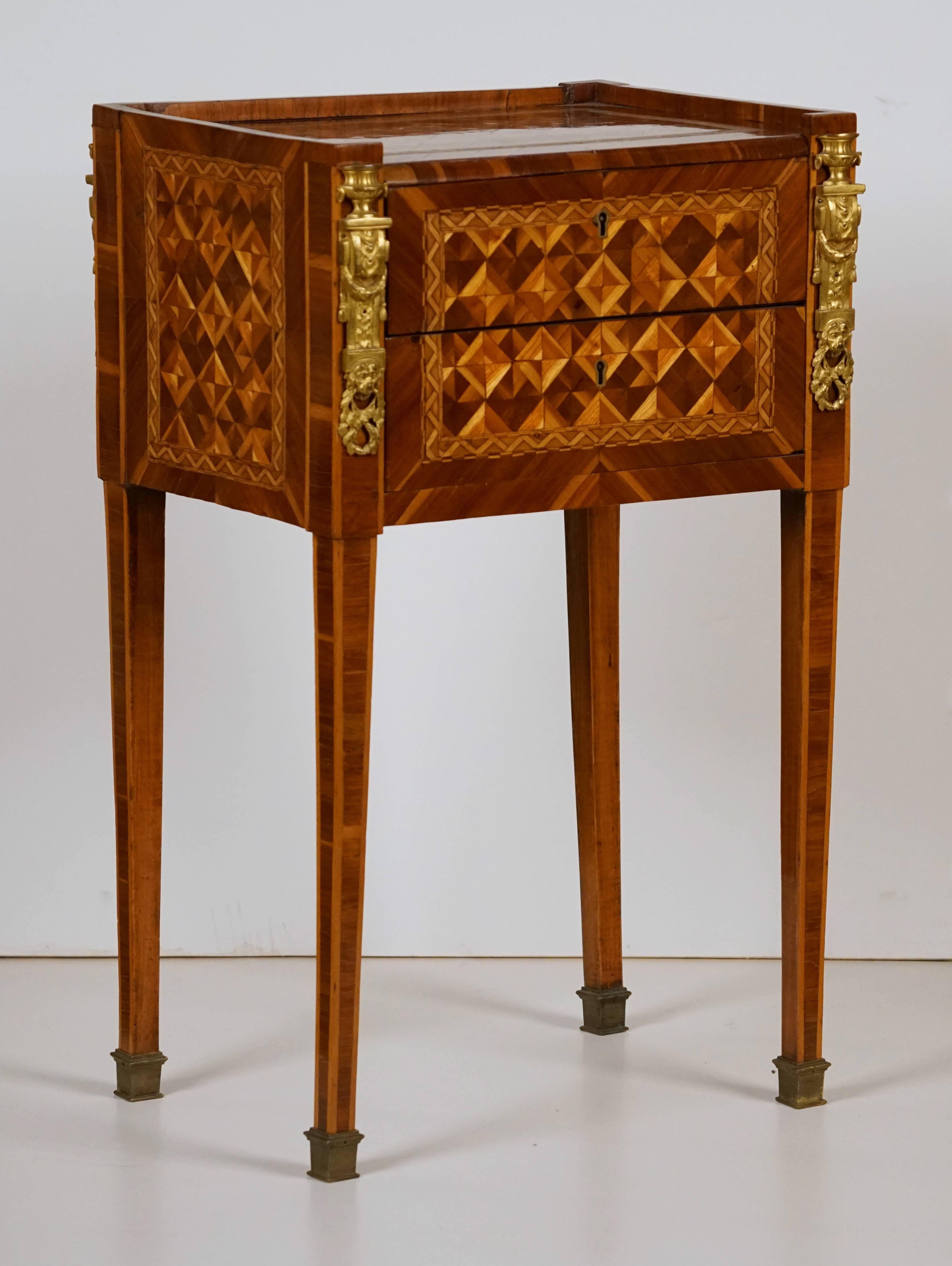 A Fine Louis XVI Ormolu Mounted 
Marquetry & Parquetry Table en Chiffoniere
18th Century
Attributed to Jean Francois Leleu

Jean Francois Leleu, Maitre in 1764

Height 28 in.   Width 17 in.   Depth 12 in.

Provenance:
Private Collection Paris,