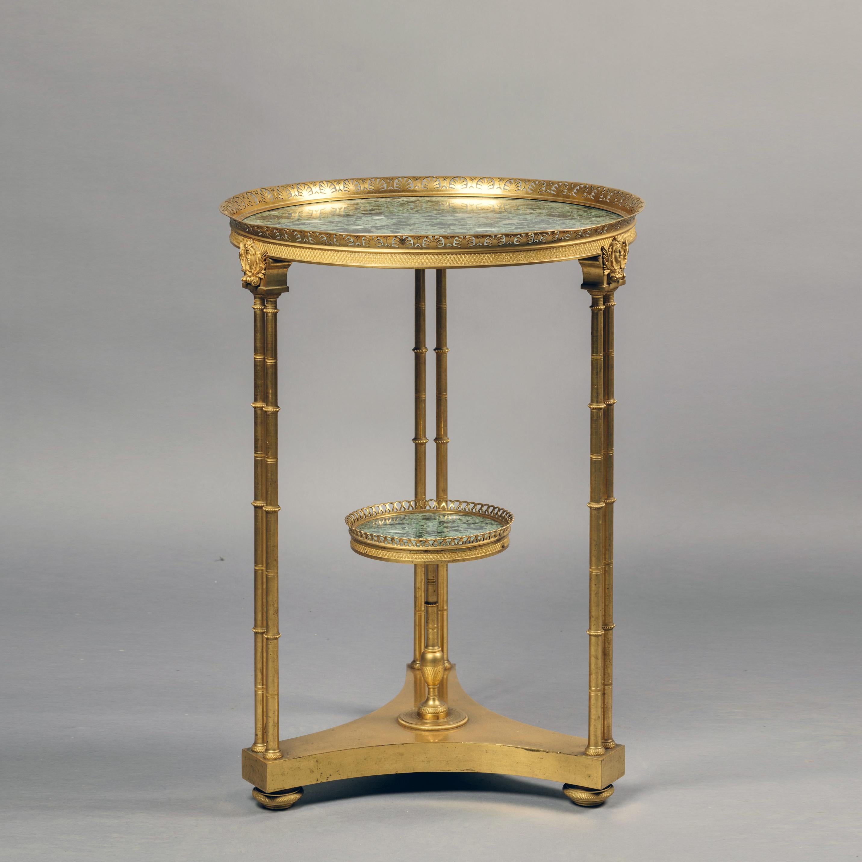 A fine Louis XVI style gilt bronze guéridon with a green Breccia marble top, after the model by Adam Weisweiller.

Of very fine quality, this elegant guéridon has a circular green breccia marble top within a pierced anthemion cast gallery above