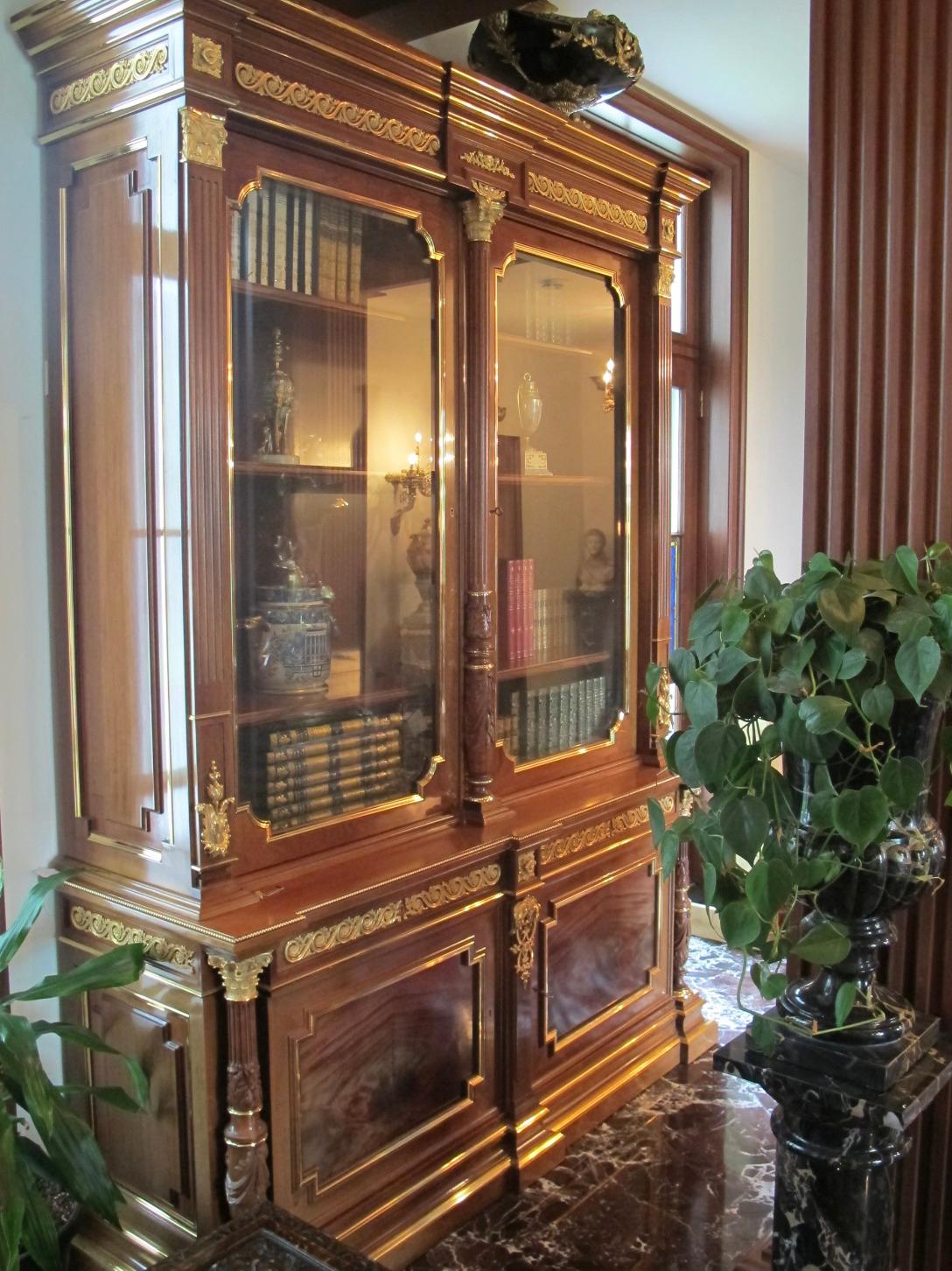 A Fine Louis XVI Style Gilt-Bronze Ormolu Mounted Mahogany Bookcase Bibliotheque, circa 1900

Of palatial size, this extremely elegant and lavish bookcase is carved from mahogany wood in two sections; the upper section with molded top over frieze,