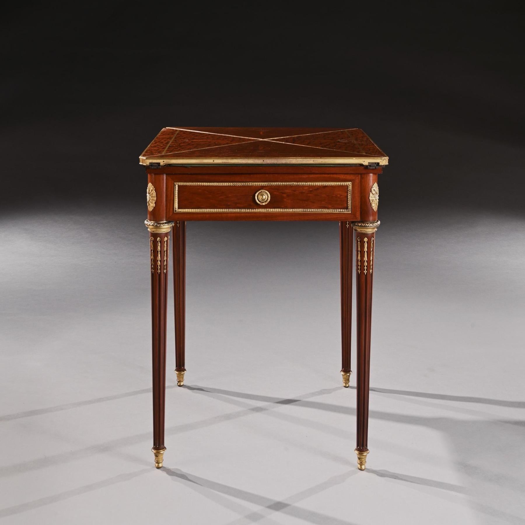 A fine quality late 19th Century / early 20th Century envelope card table with ormolu mounts by Lampre of Paris 

French Paris Circa 1900.

Of envelope form this card table is twisted for the table to be opened allowing each leaf to rest on the