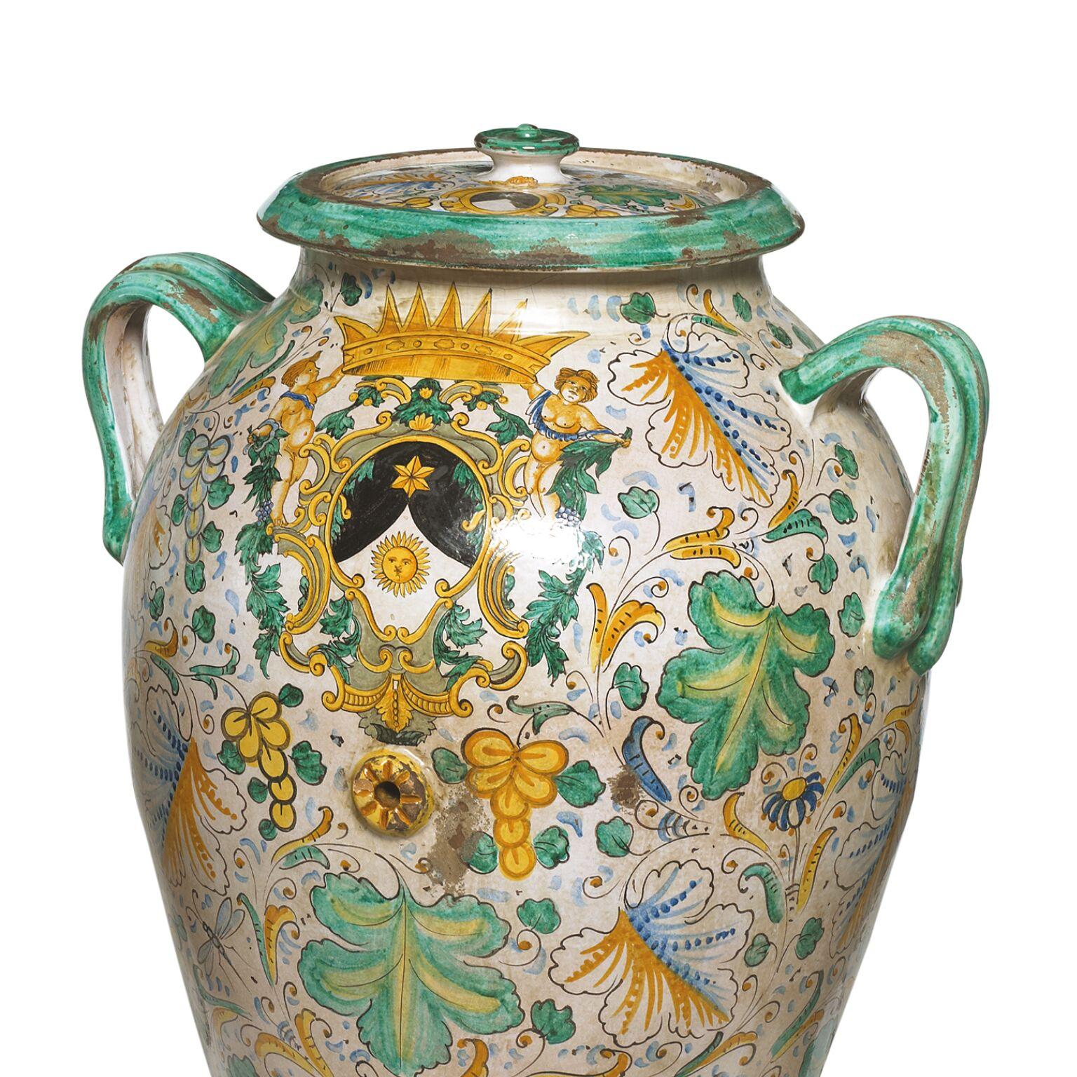 A magnificent matched pair of hand painted Majolica covered urns

Italian/ Spanish early 20th century

approximately 80cm high, approximate diameter 70cm

These sensational Majolica jars with covers would look great in a courtyard, by a pool,