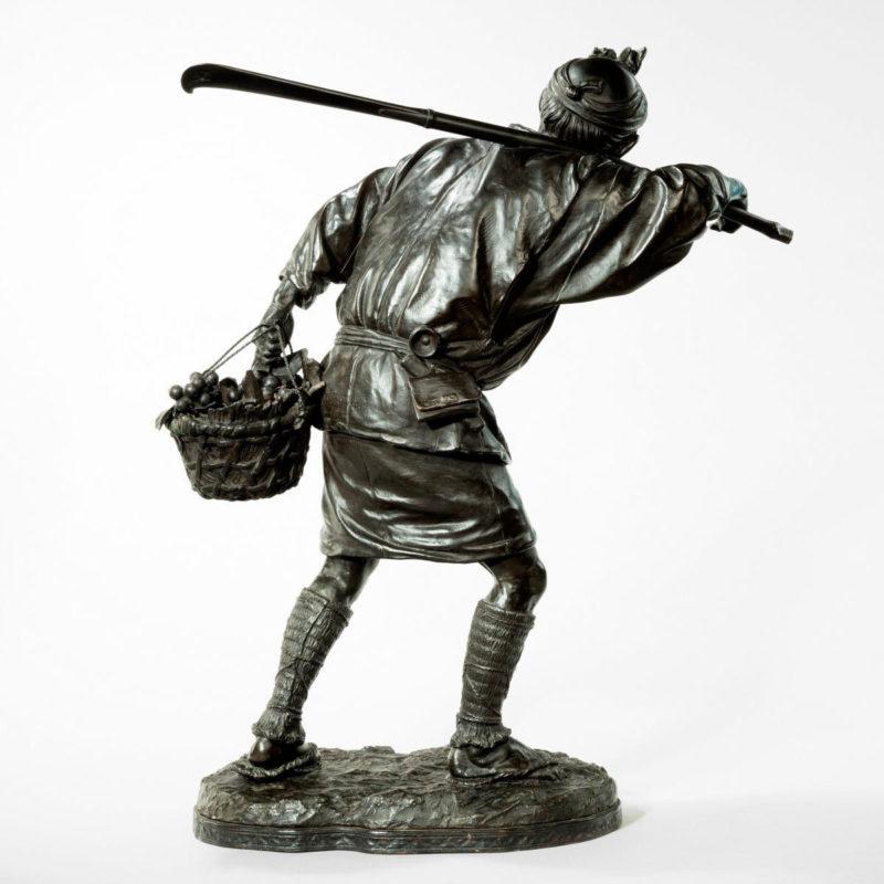 A fine Meiji period bronze of a fruit picker by UDAGAWA In Good Condition For Sale In Lymington, Hampshire