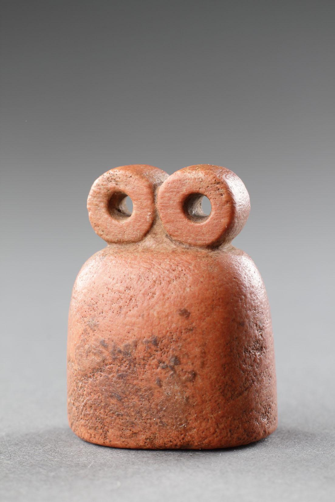 A Fine Mesopotamian ‘Eye Idol’
Red Quartzite
Northern Mesopotamia
Circa 3200 BC

Size: 3.5cm high, 3cm wide, 2cm deep - 1½ ins high, 1¼ ins wide, ¾ ins deep 

Provenance: 
Sold Pierre Berge, Paris, 27th - 28th October 2006, lot 484; property of a