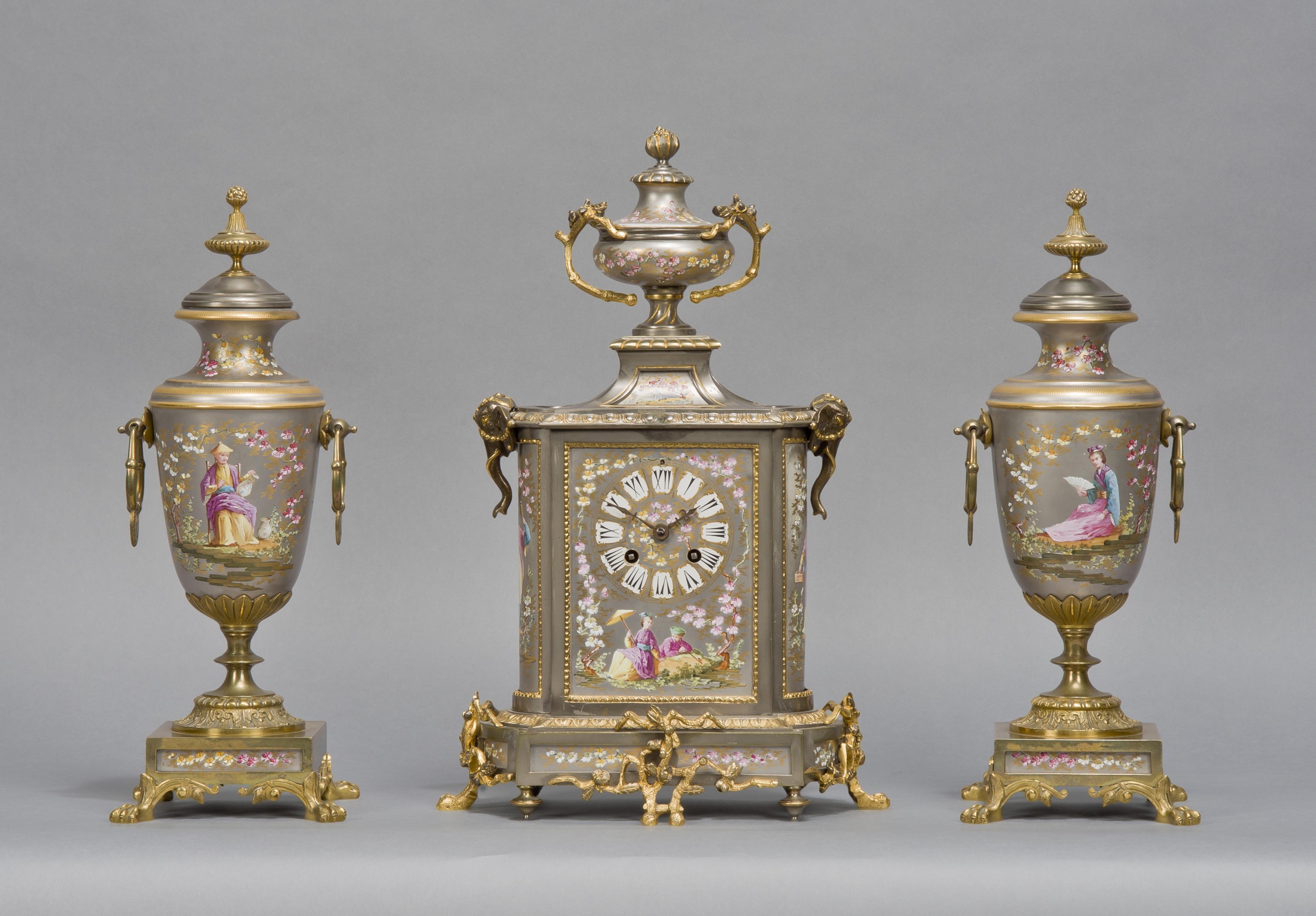 A fine Napoléon III gilt-bronze mounted porcelain clock garniture.

French, circa 1870. 

The movement stamped with the 'Japy Frères ' cachet.

This fine porcelain clock set is decorated in the Japonisme style which was popular in France from