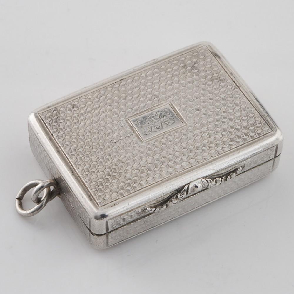 Heading : Sterling silver Vinaigrette
Date : Hallmarked in Birmingham in 1832 for Nathaniel Mills
Period : William IV
Origin : Birmingham, England
Decoration : Embellished with tooled decoration and the monogram HL. Parcel gilt interior with