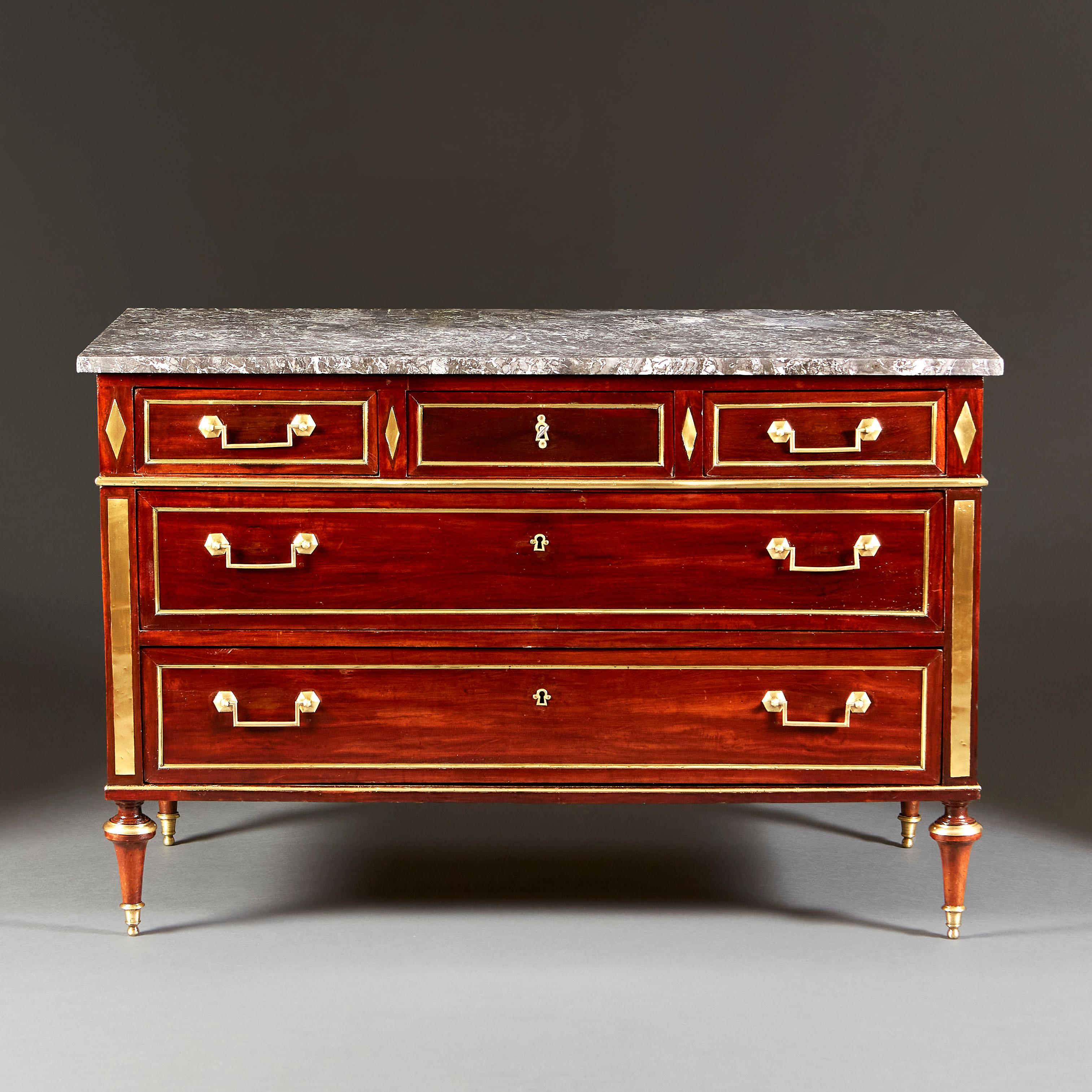 French, circa 1820

A fine early nineteenth century mahogany Empire commode, with three graduated drawers with a diamond brass inlay and rectangular lozenges of brass, retaining the original marble top. All supported on elongated topie feet.

Height