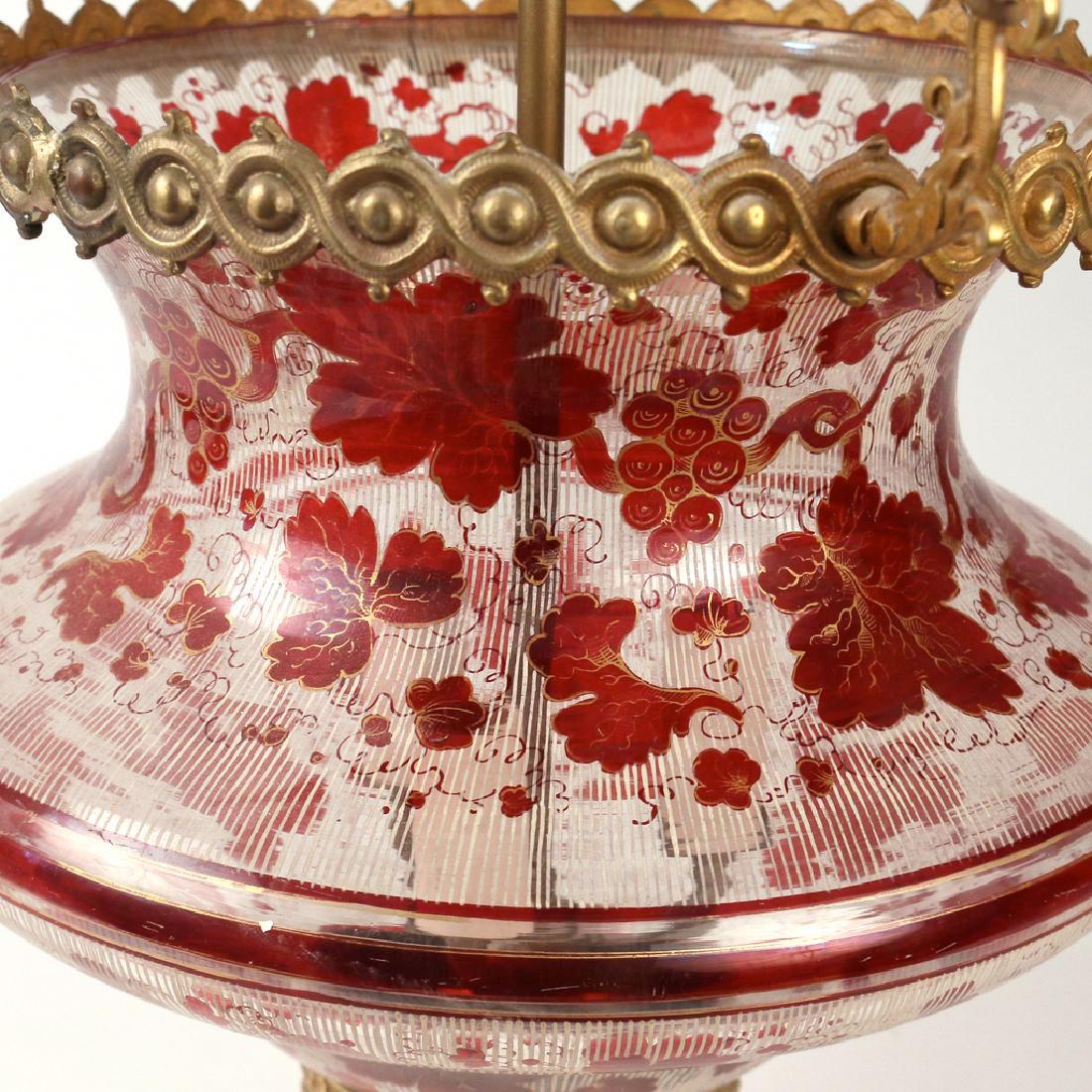 With red grape-vine scrolling designs and ormolu mounts.

Origin: Bohemia
Date: 19th century
Dimension: 24 in. x 12 in.