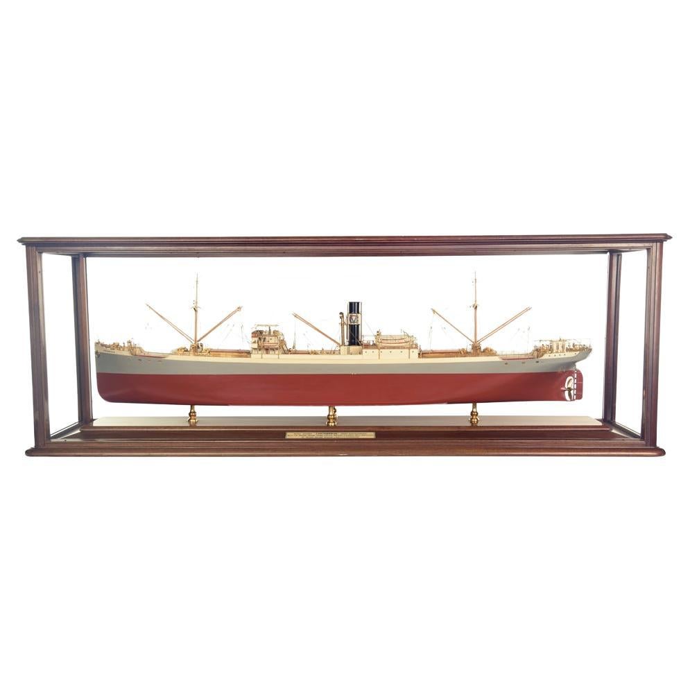 A Fine Ship Builder’s Model of S. S. Forthbridge, circa 1928 The hull of this model is built up in lifts (or planks), with a painted dark red bottom and grey and white topsides.  It is marked at the bow and stern with draft markings, and at the