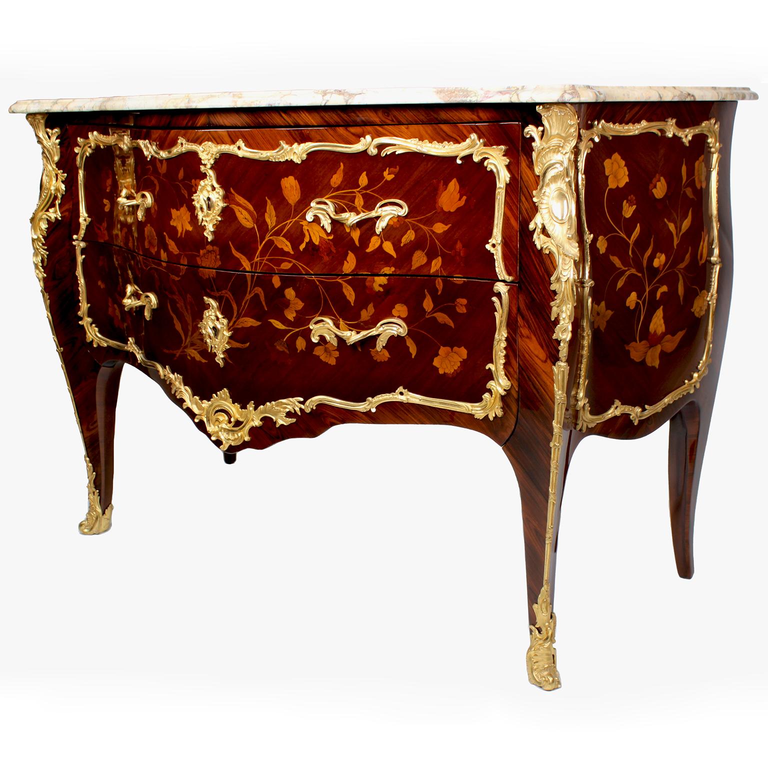 A very fine pair of French 19th century Louis XV style gilt-bronze mounted floral marquetry Bombé commodes with marble top. The serpentine two-drawer commodes, with rosewood, king-wood and fruit-wood floral inlaid, surmounted with finely chased