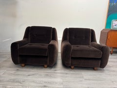 A fine pair Italian lounge chairs in chocolate brown velvet