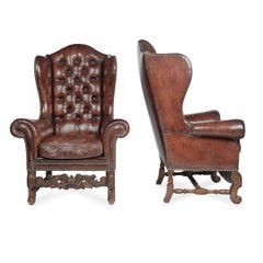 A Fine Pair of 1920s Walnut and Leather Wing Chairs in the Late Baroque Manner