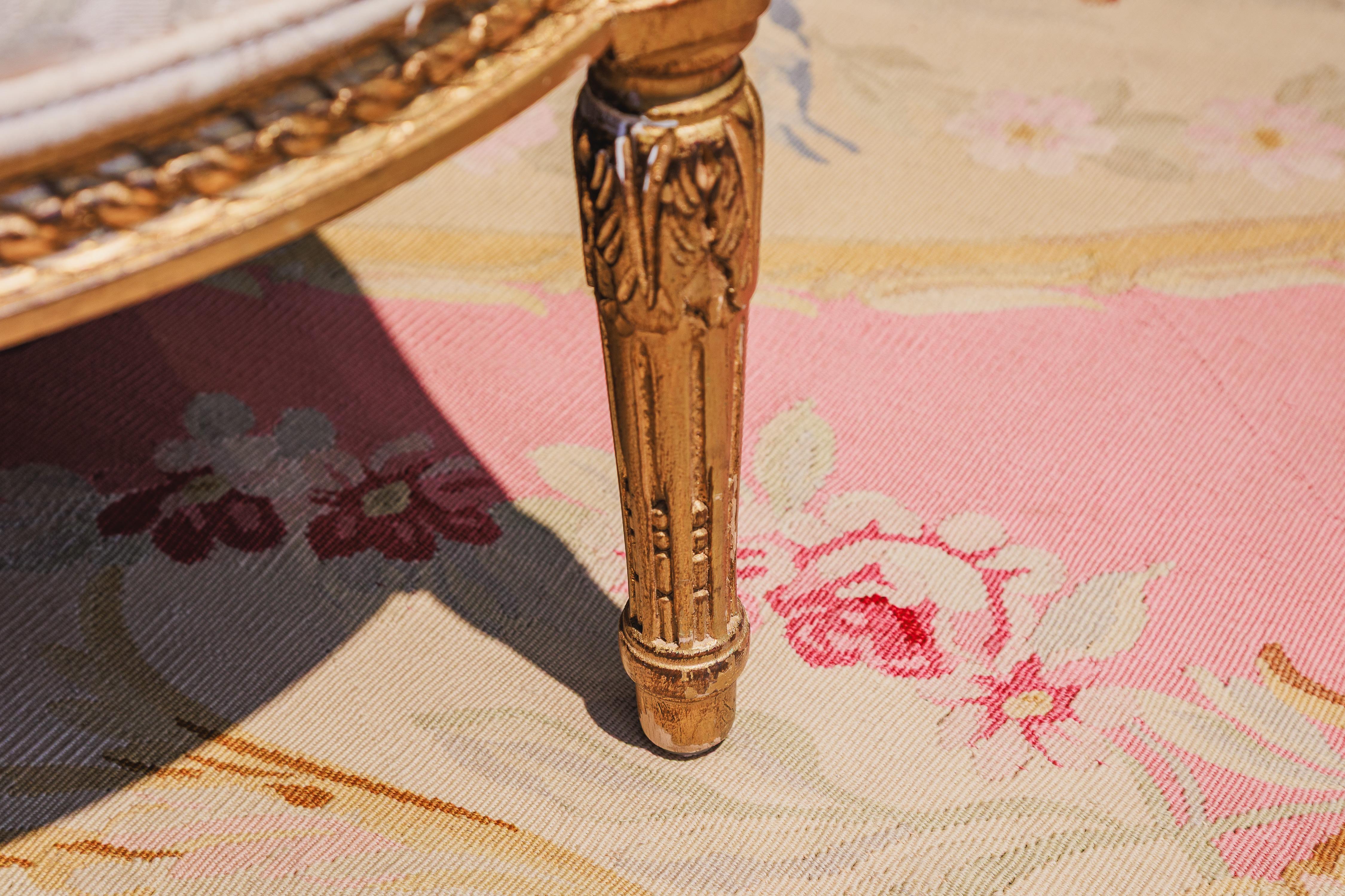 Français A fine pair of 19th c French Louis XVI gilt carved bergeres. en vente