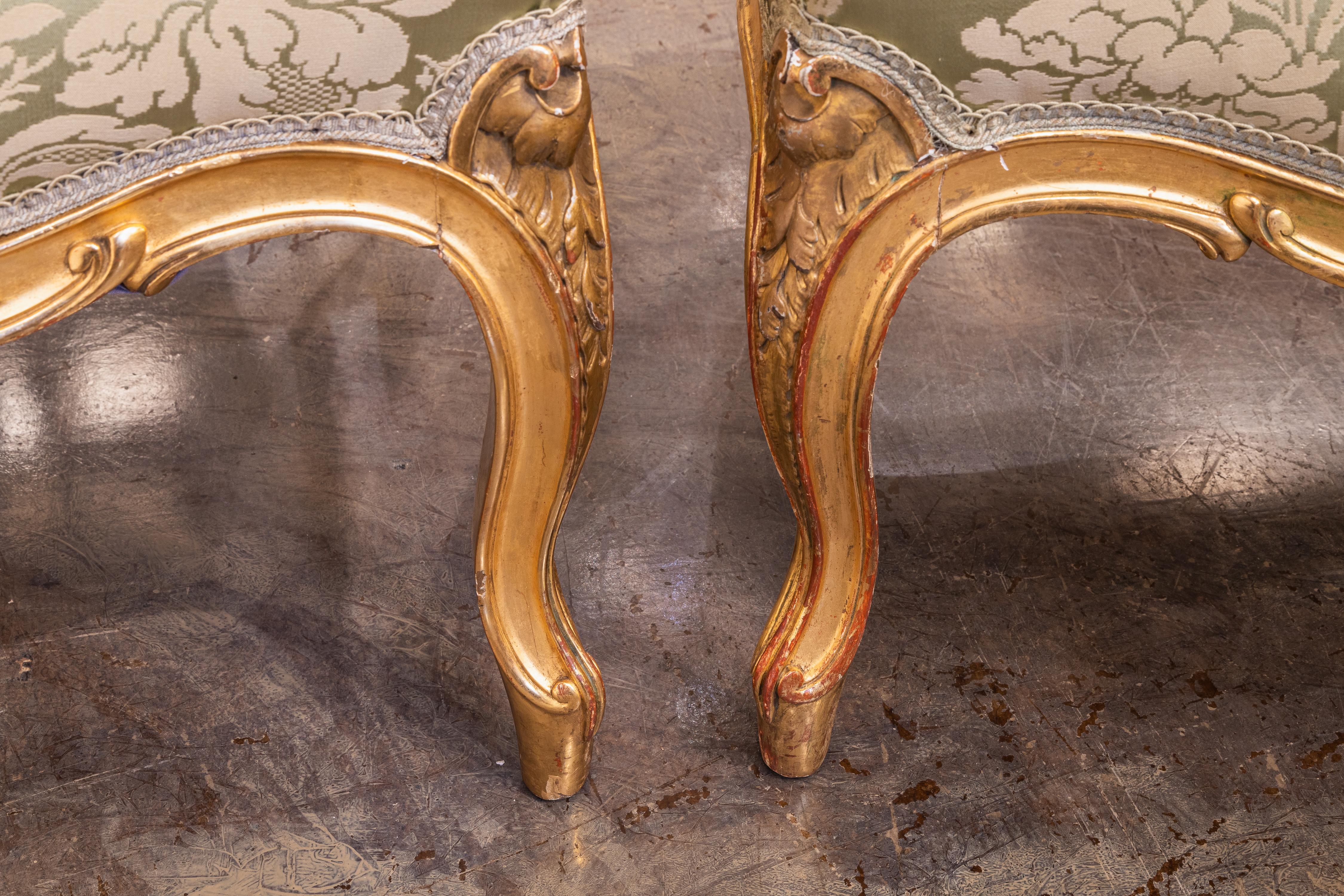 French A fine pair of 19th c Louis XV water gilt fauteuils . Fine carving with a silk  For Sale