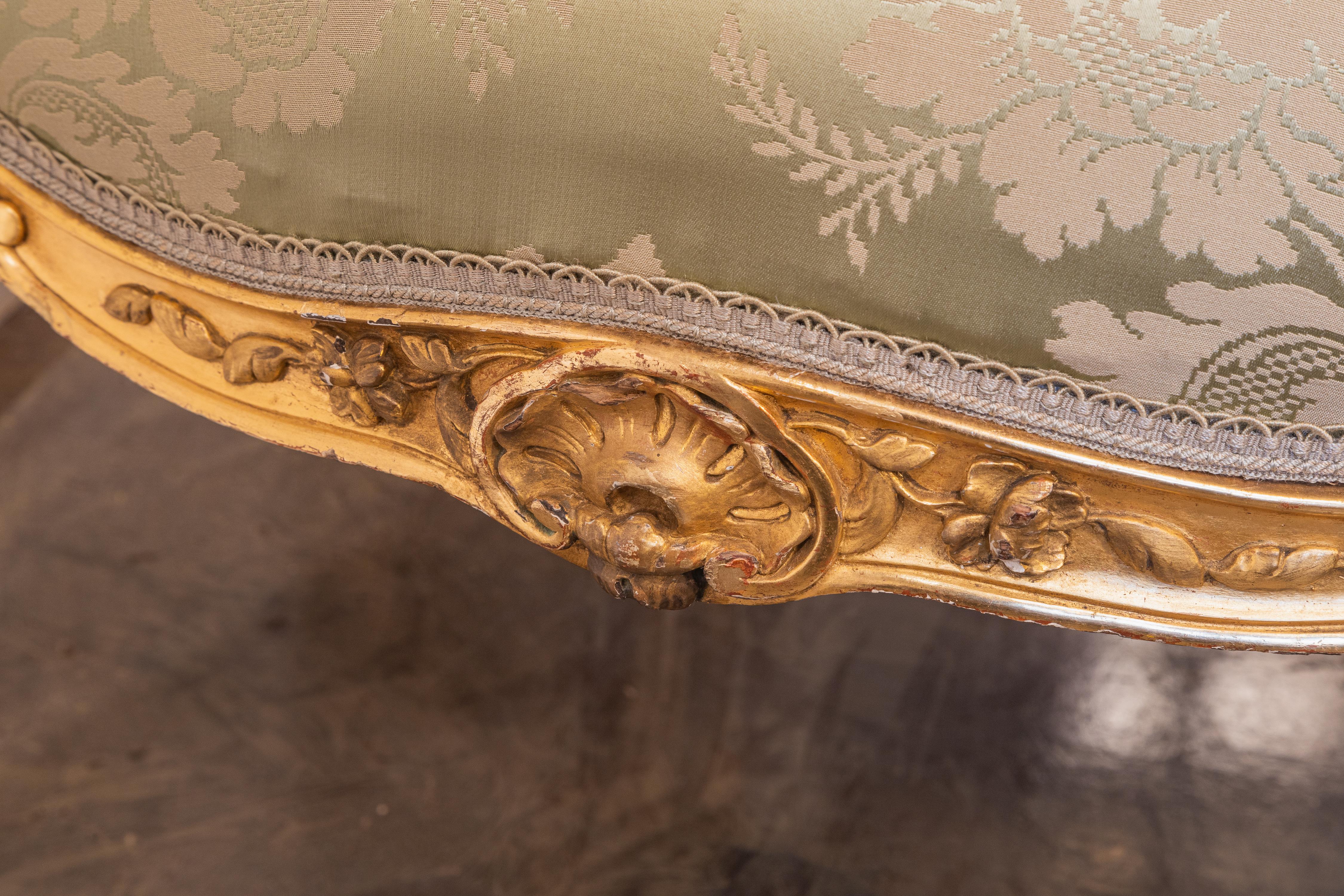 Hand-Carved A fine pair of 19th c Louis XV water gilt fauteuils . Fine carving with a silk  For Sale