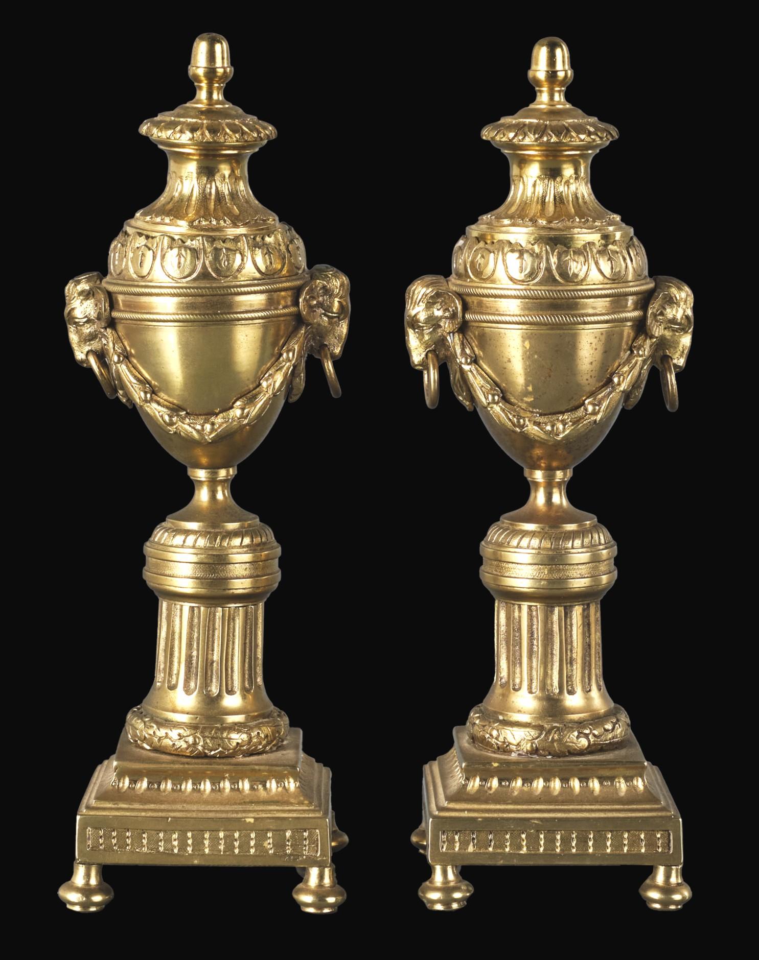 A very fine pair of Neoclassical Revival gilt bronze cassolettes / candlesticks after a design by Matthew Boulton (1728-1809). 
Both finely cast & richly gilded amphora shaped bodies decorated with neoclassical elements of ram’s heads & bellflower