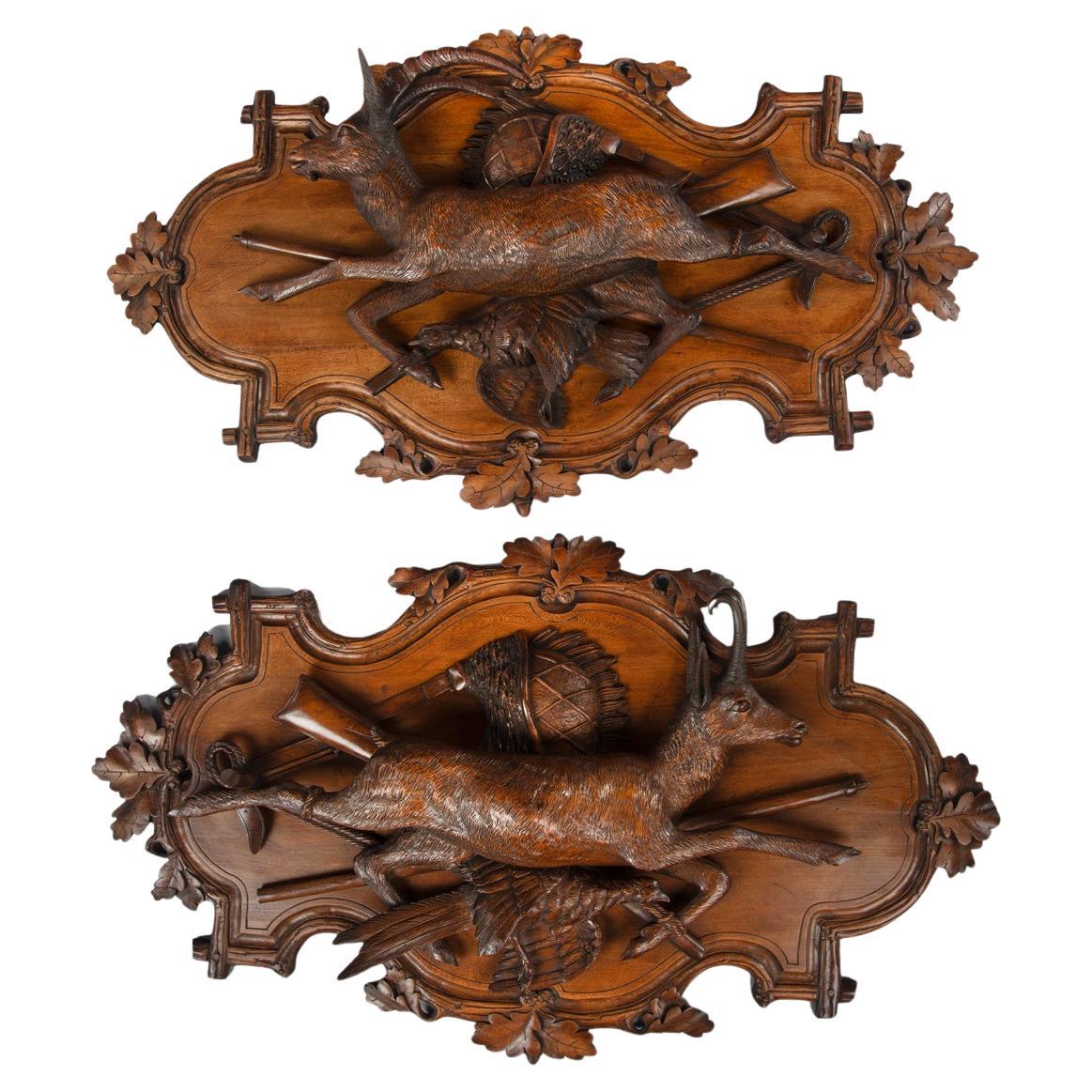 A fine pair of 19th century Black Forest Walnut game plaques attributed to Johan For Sale