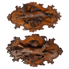 A fine pair of 19th century Black Forest Walnut game plaques attributed to Johan