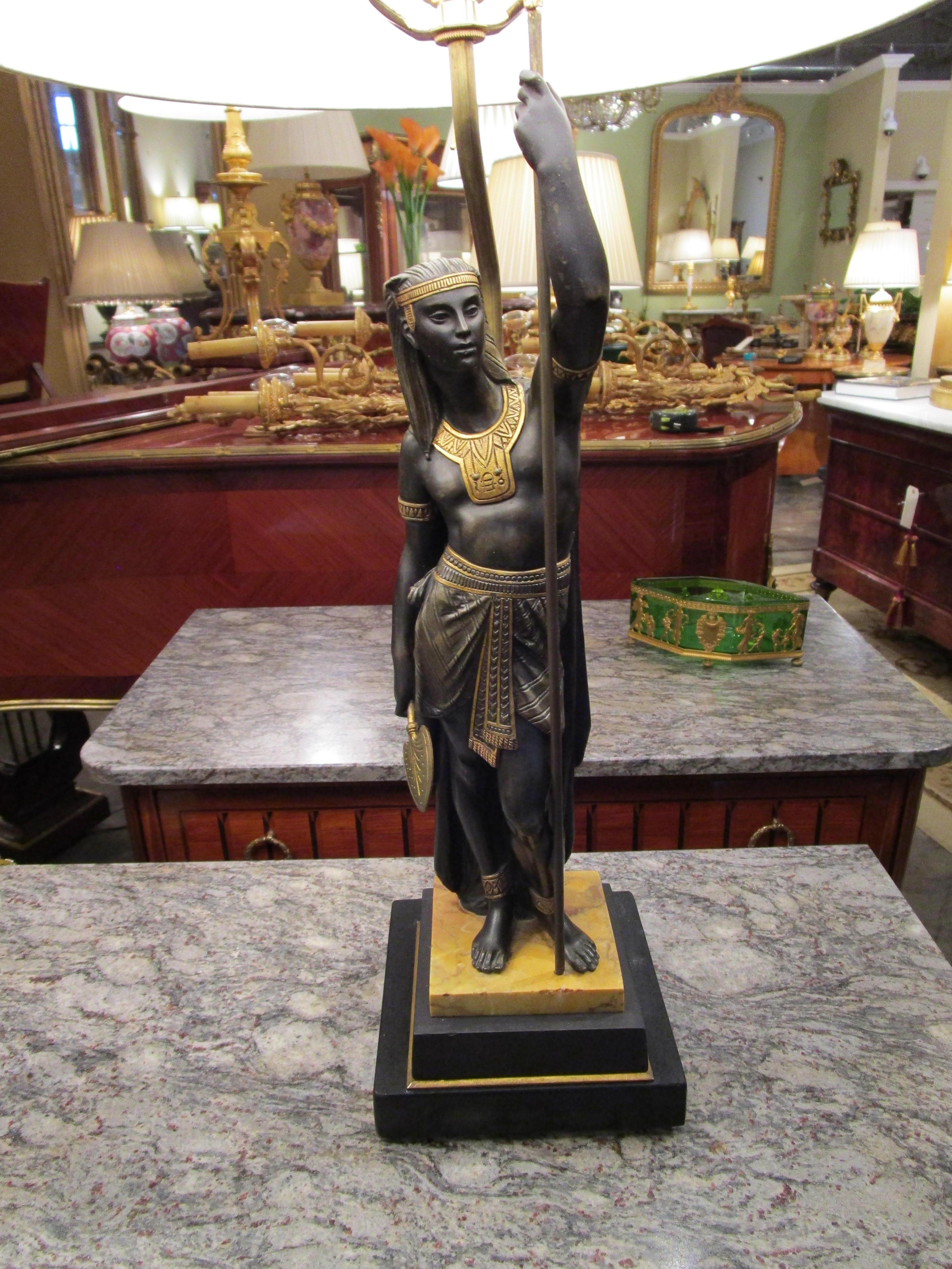 A wonderful pair of 19th century French Egyptian revival bronze figures with gilt bronze accents. In the style of Picault . Fine casting and details. Made into lamps with custom bases.