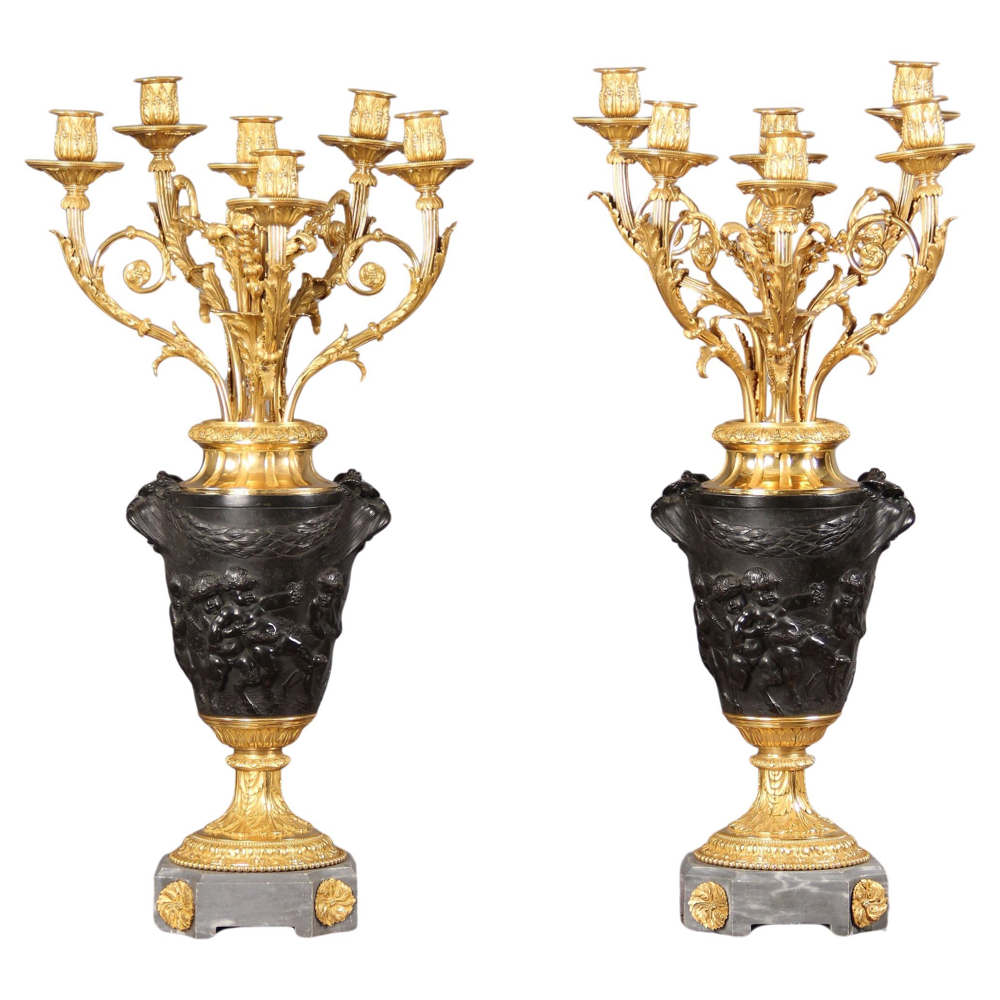 Fino par de candelabros del siglo XIX según Claude Michel Clodion