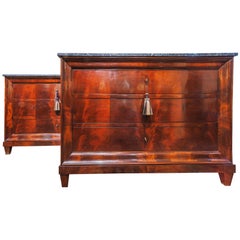 A fine pair of 19th century Charles X mahogany and marble top commodes.