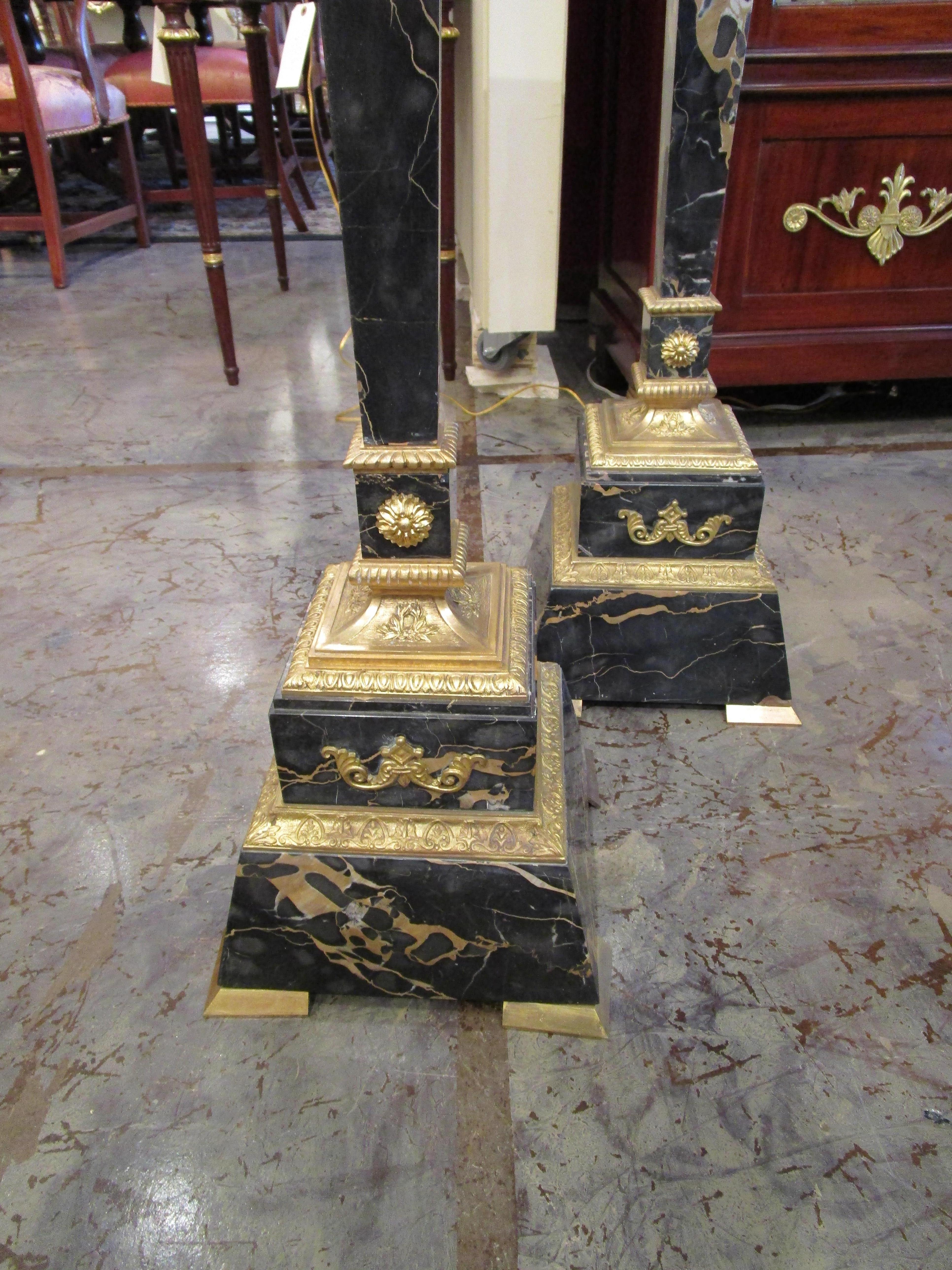 A fine pair of 19th century Empire marble and gilt bronze pedestals. Fine gilt bronze mounts with Egyptian. The tops revolve.