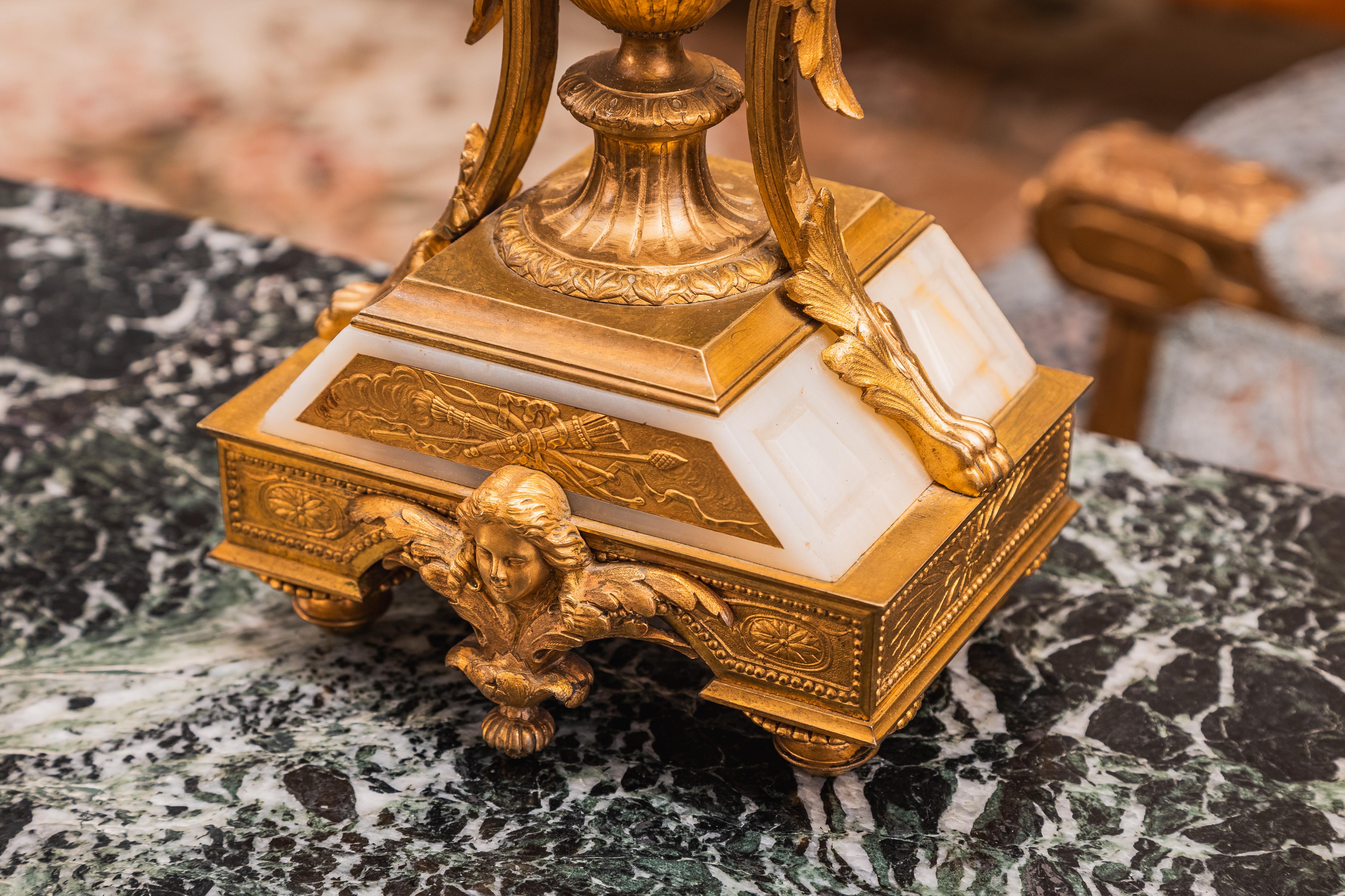 A fine pair of 19th century French Louis XVI alabaster and gilt bronze lamps.