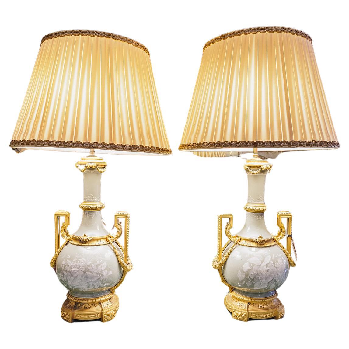 A very fine pair of 19th century French celadon porcelain and gilt bronze mounted lamps . Finest quality . Large size 