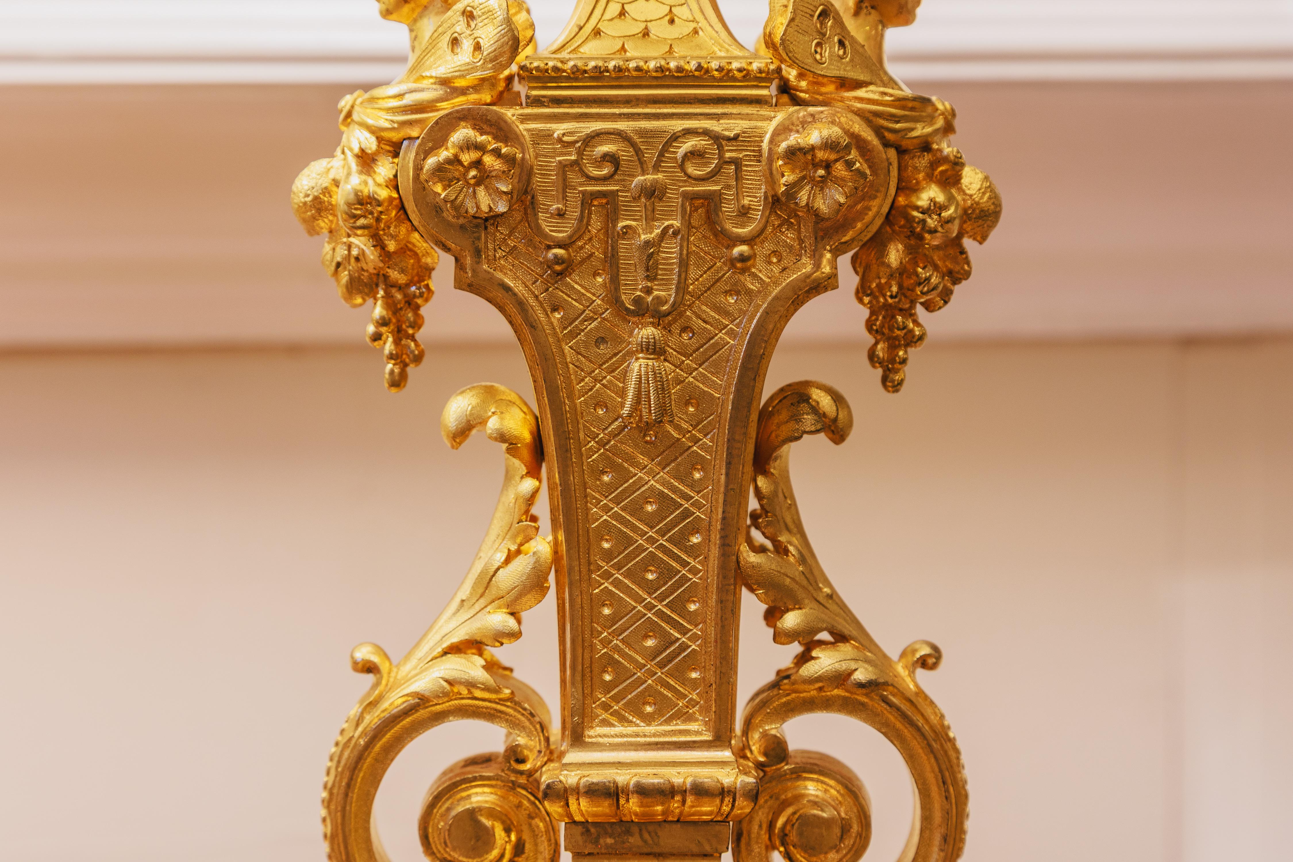 Gilt A fine pair of 19th century French gilt bronze cherub lamps