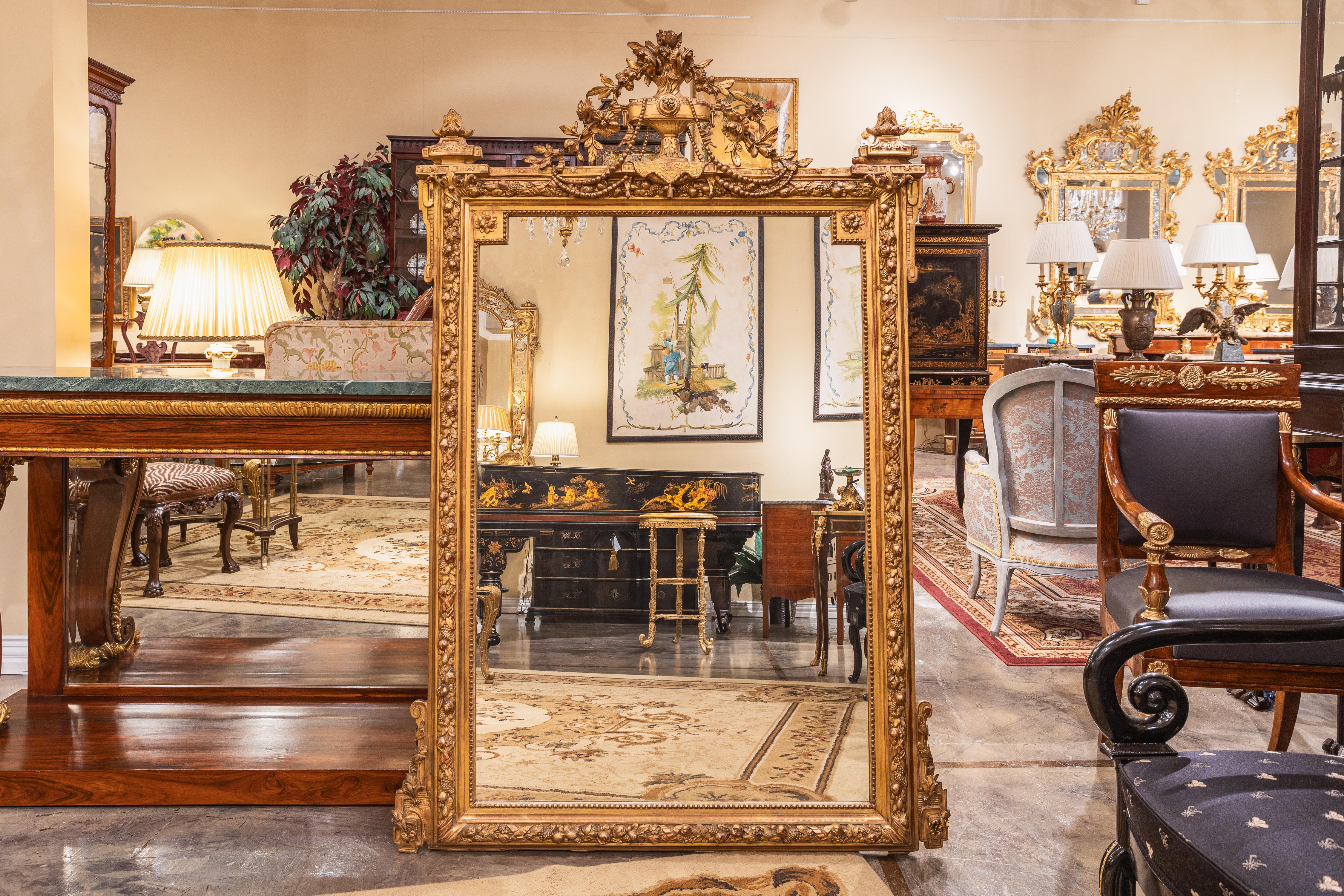 A fine pair of hand carved 19th century French Louis XVI gilt mirrors. Finely carved with the original mirrors 