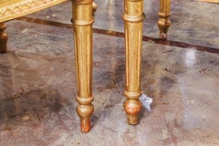 A fine pair of 19th century French Louis XVI gilt carved armchairs
