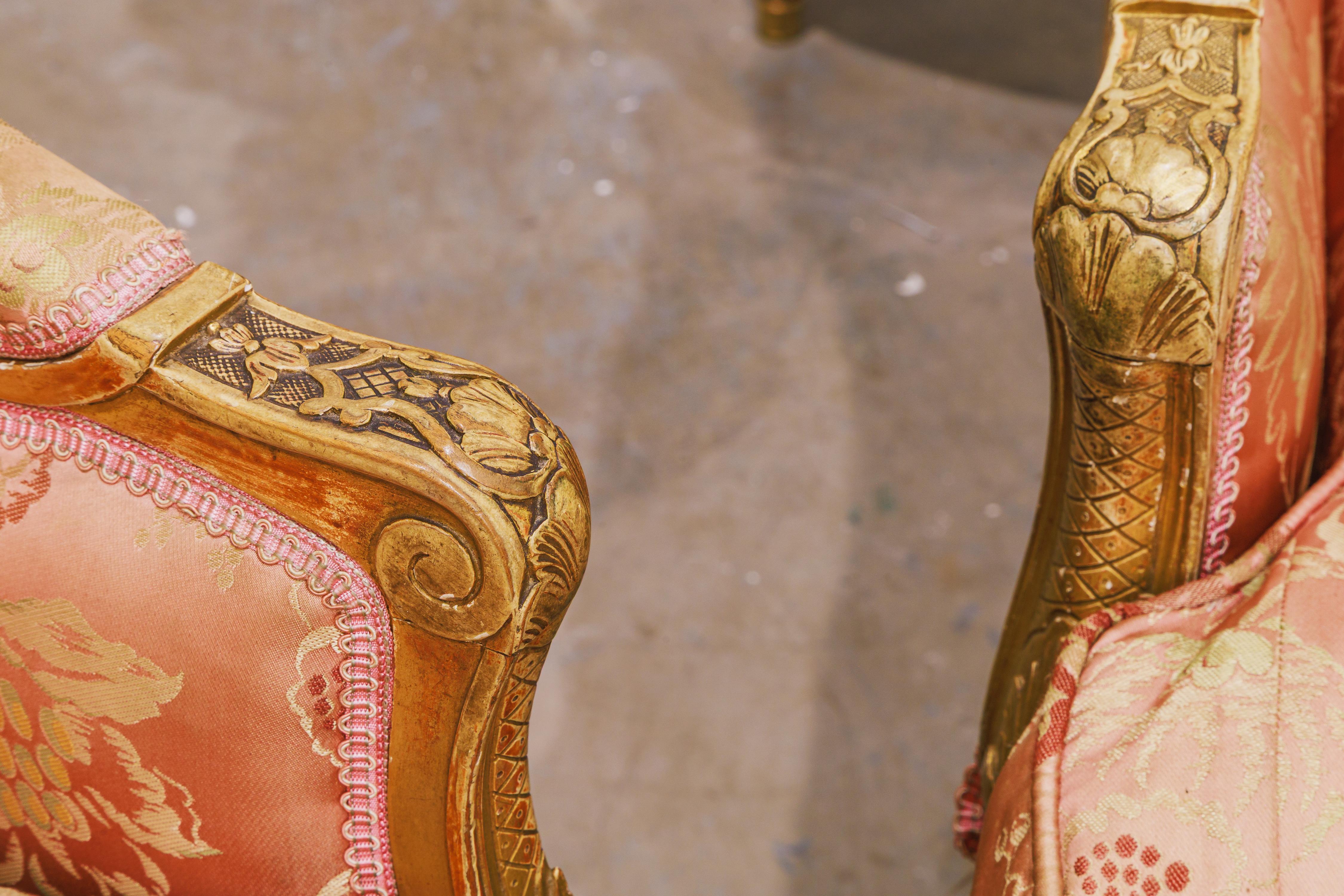 A fine pair of 19th century French  Louis XVI  gilt carved large wing chairs In Good Condition For Sale In Dallas, TX