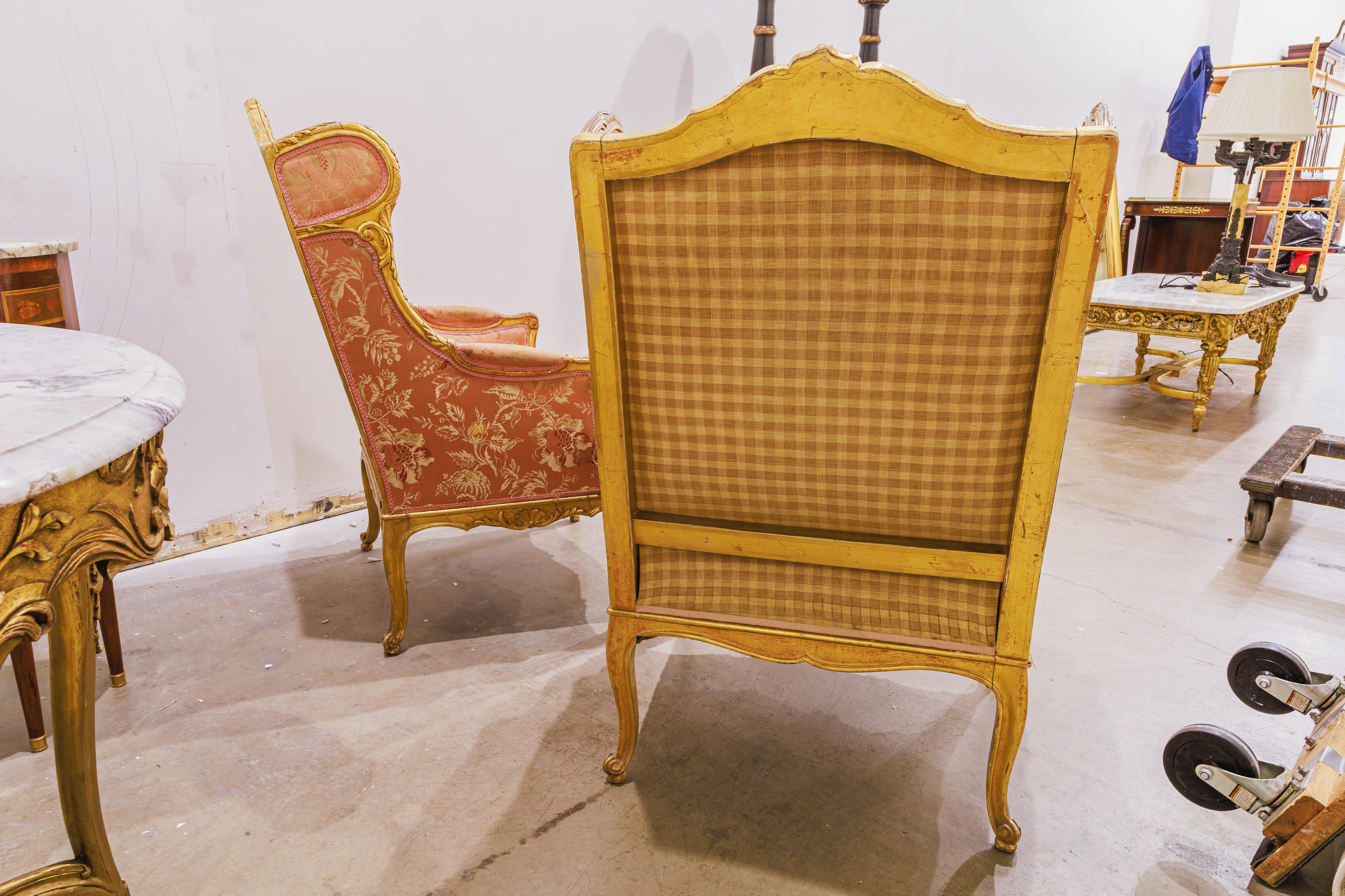 Giltwood A fine pair of 19th century French  Louis XVI  gilt carved large wing chairs For Sale