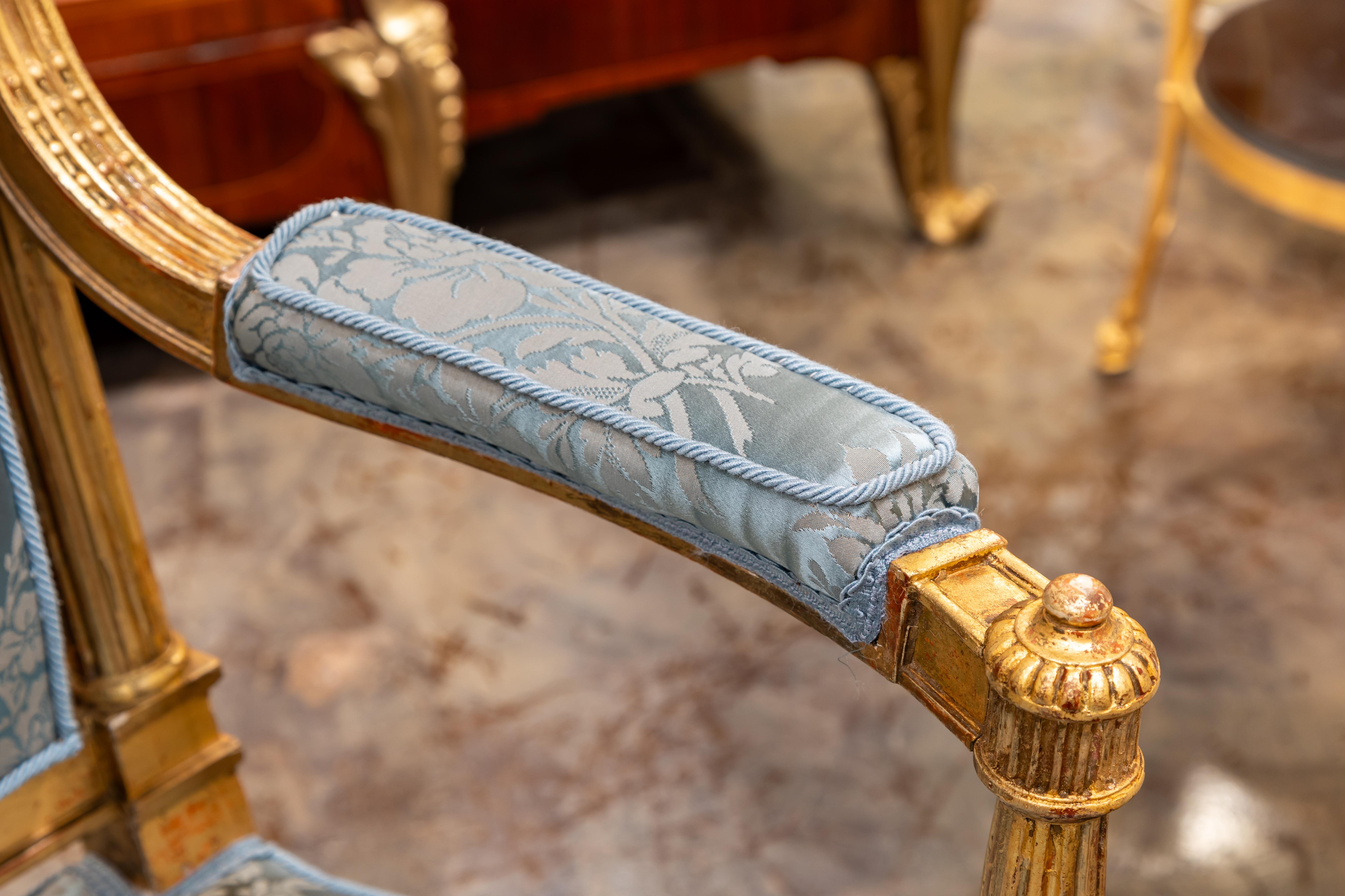 Giltwood A fine pair of 19th century French Louis XVI hand carved and gilded armchairs.  For Sale