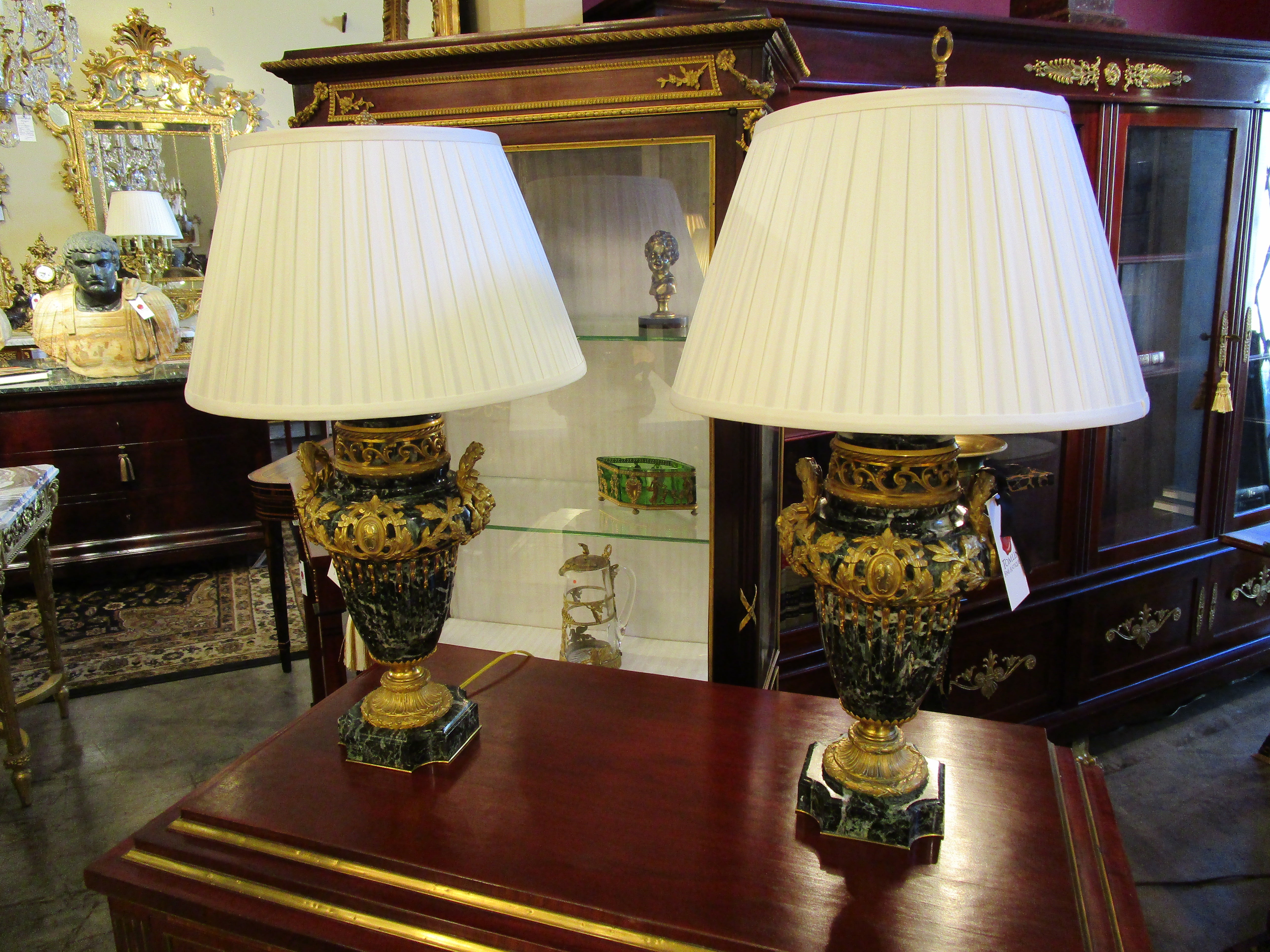 A very fine 19th century Louis XVI green marble and gilt bronze urns. Fine quality gilt bronze mounts. 