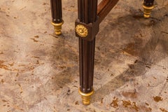 A fine pair of 19th century French Louis XVI marble top tables