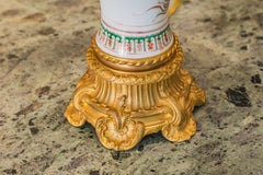 A fine pair of 19th century French porcelain and gilt bronze oil lamps .