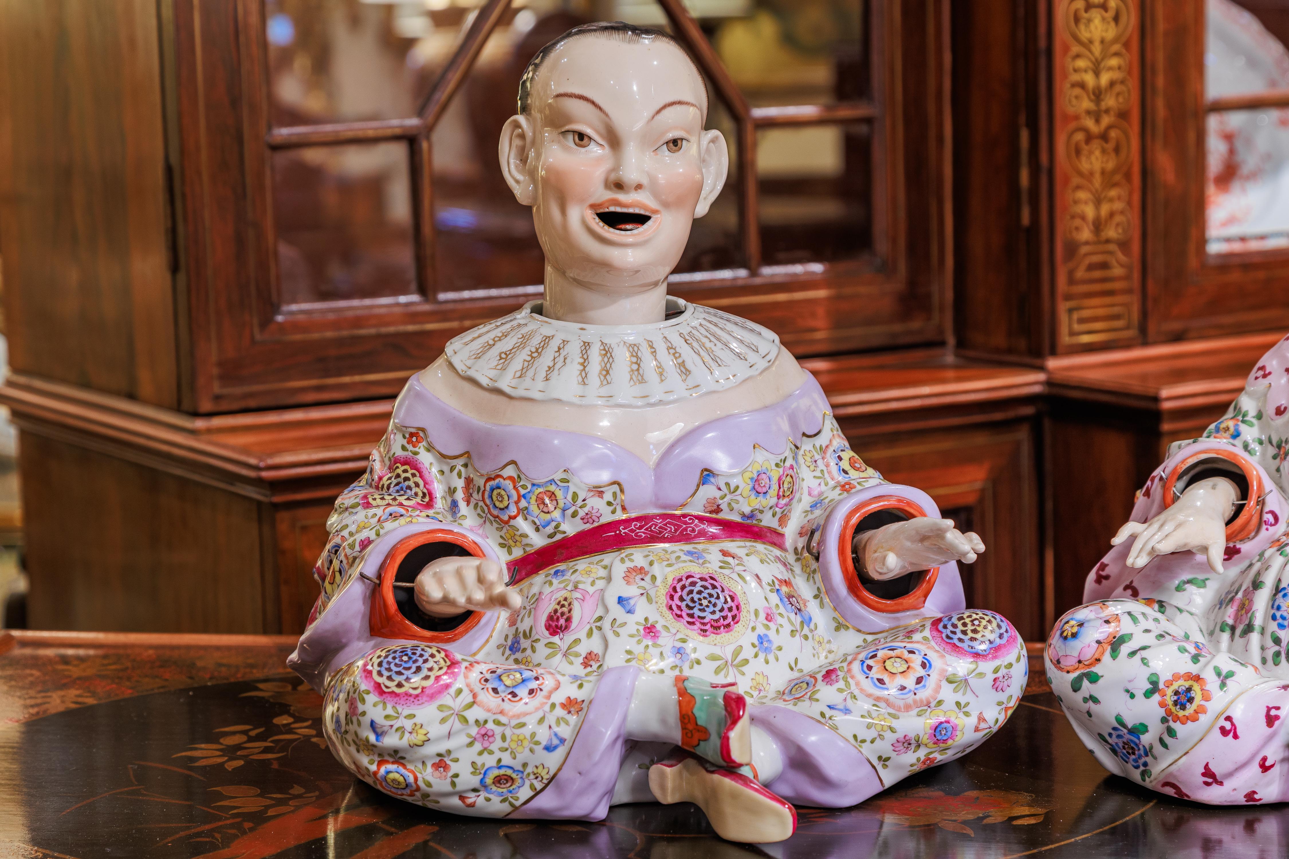 A fine pair of late 19th century large German hand painted Chinese nodder figures . Elaborate hand decorated wardrobes. 