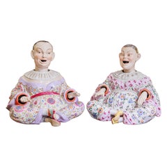 A fine pair of 19th century German porcelain large hand painted Nodders