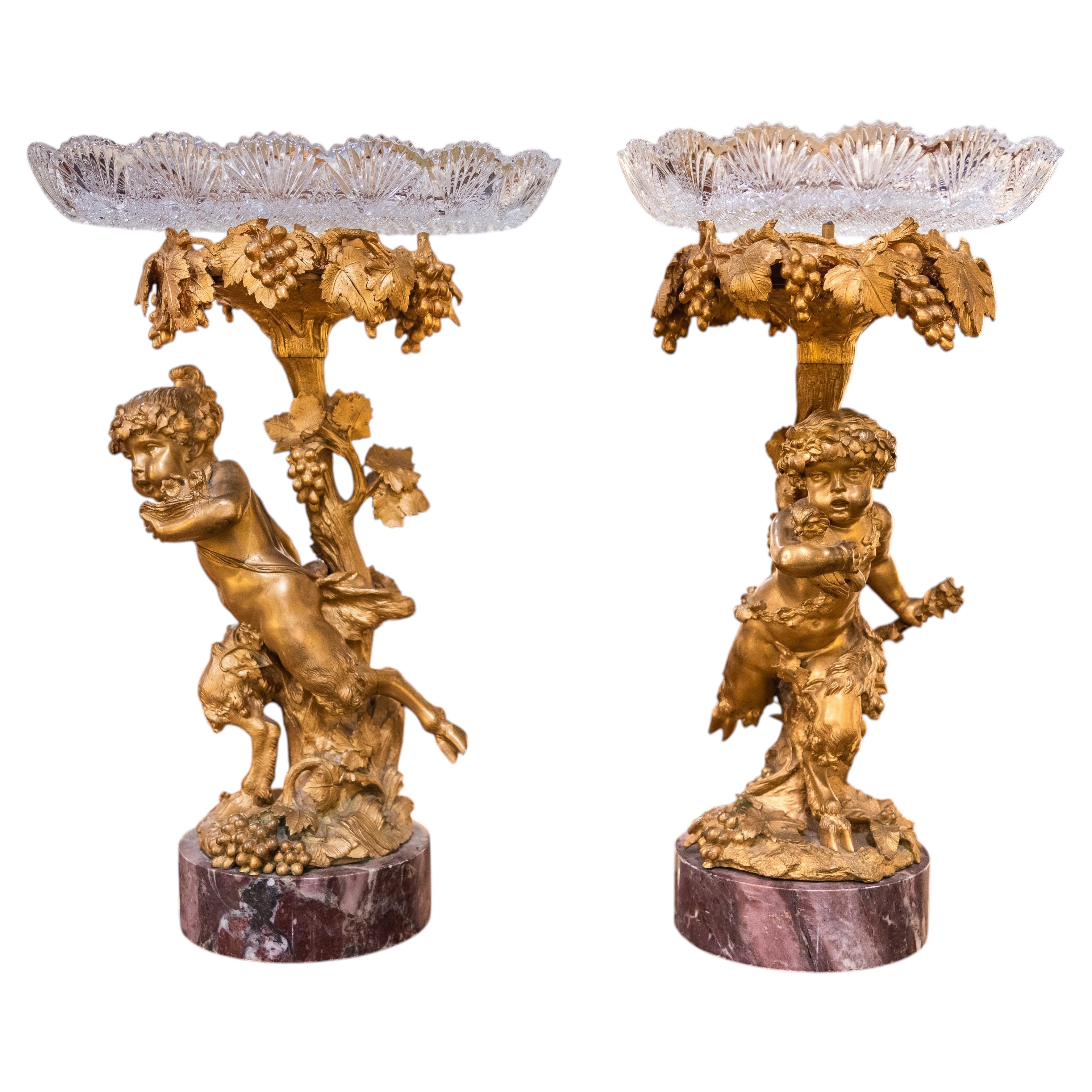 A fine pair of 19th century gilt bronze cherubs with crystal tops and marble bas For Sale
