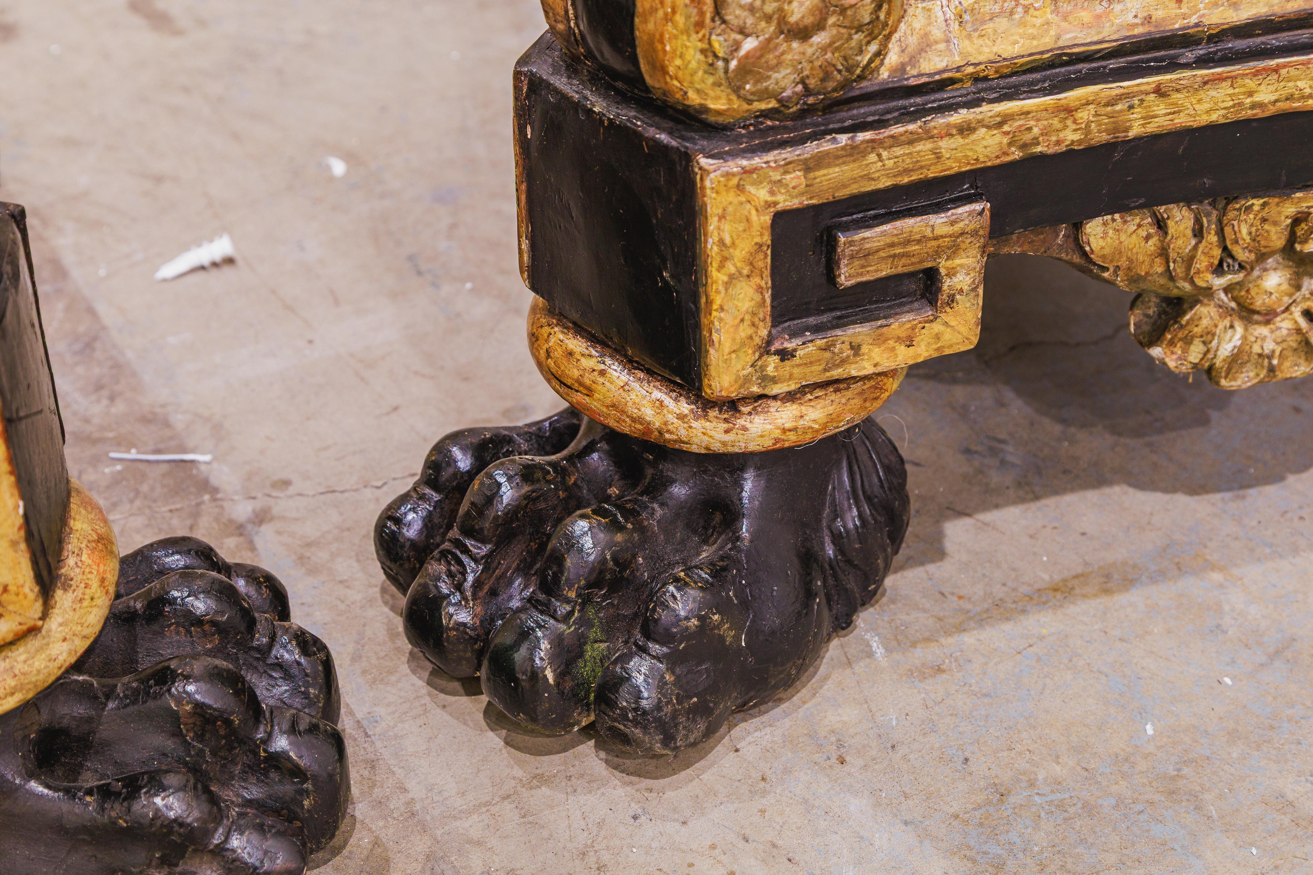 Renaissance A fine pair of 19th century Italian painted black and gilt carved torchieres For Sale