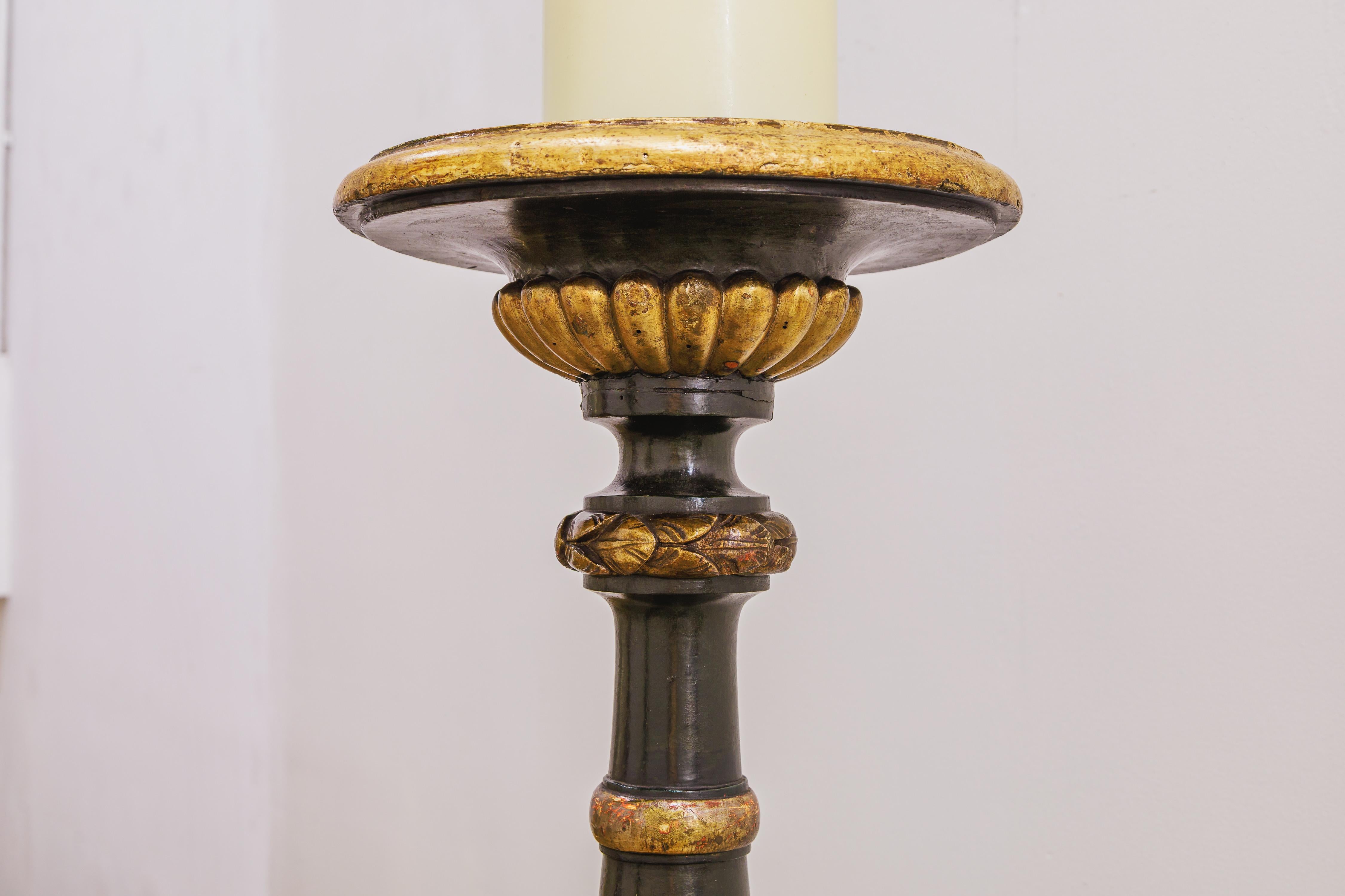 19th Century A fine pair of 19th century Italian painted black and gilt carved torchieres For Sale
