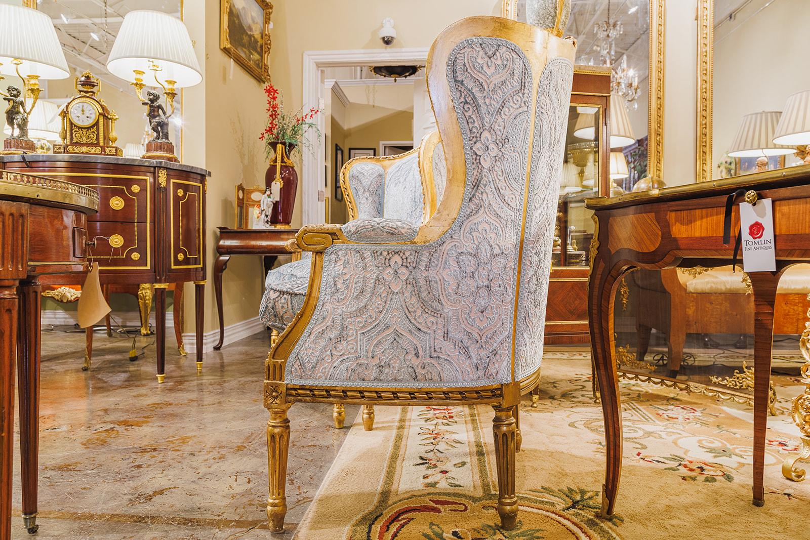 A fine pair of 19th century Louis XVI water gilt and carved wingchairs  In Good Condition For Sale In Dallas, TX