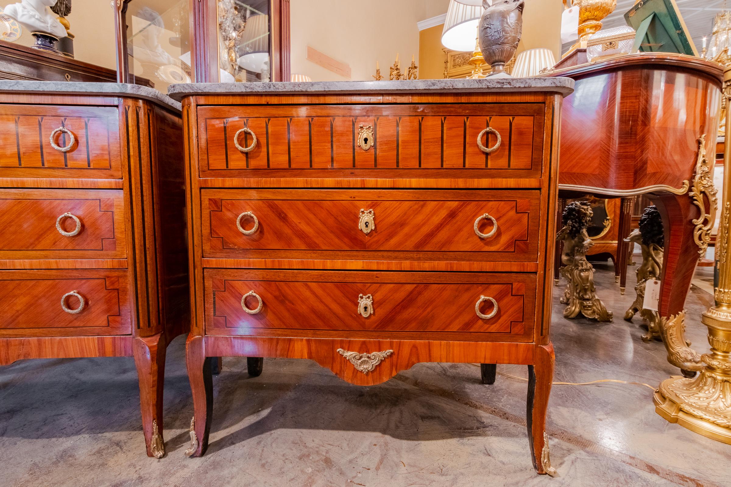 A fine pair of late 19th century Italian Louis XV mahogany and satinwood inlayed marble top nightstand commodes. Gilt bronze details.