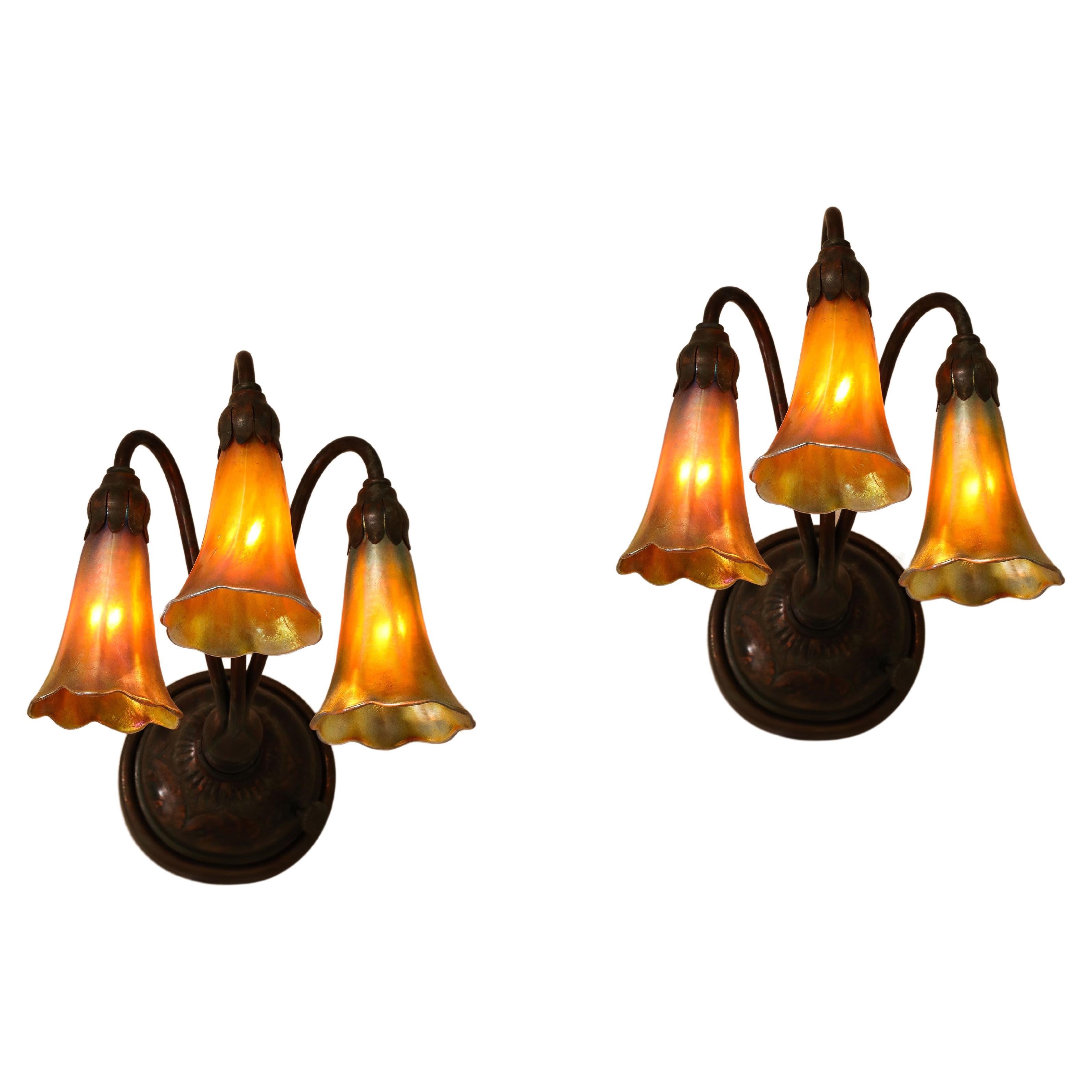 A Fine Pair of 3 Light Wall Sconces, by Tiffany Studios For Sale