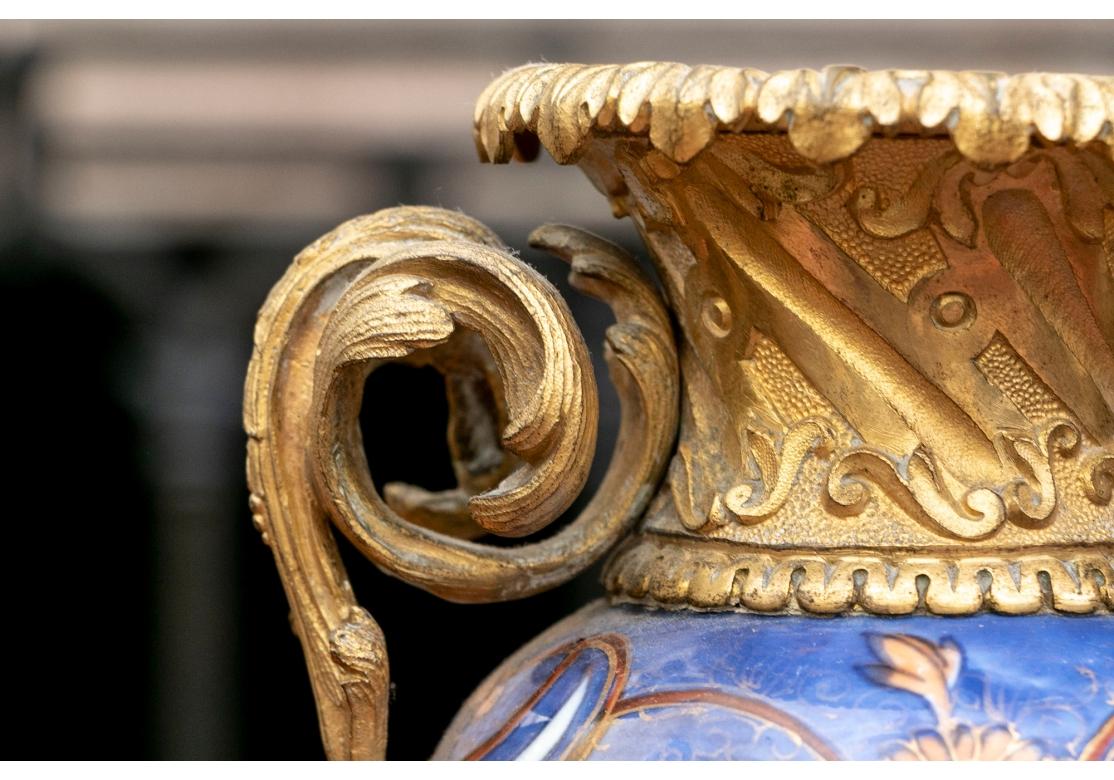 A Fine Pair Of Antique Ormolu Mounted Imari Decorated Porcelain Vases In Fair Condition For Sale In Bridgeport, CT