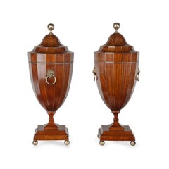 A Fine Pair of Brass Strung Mahogany Knife Urns with Armorials