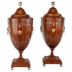 A Fine Pair of Brass Strung Mahogany Knife Urns with Armorials