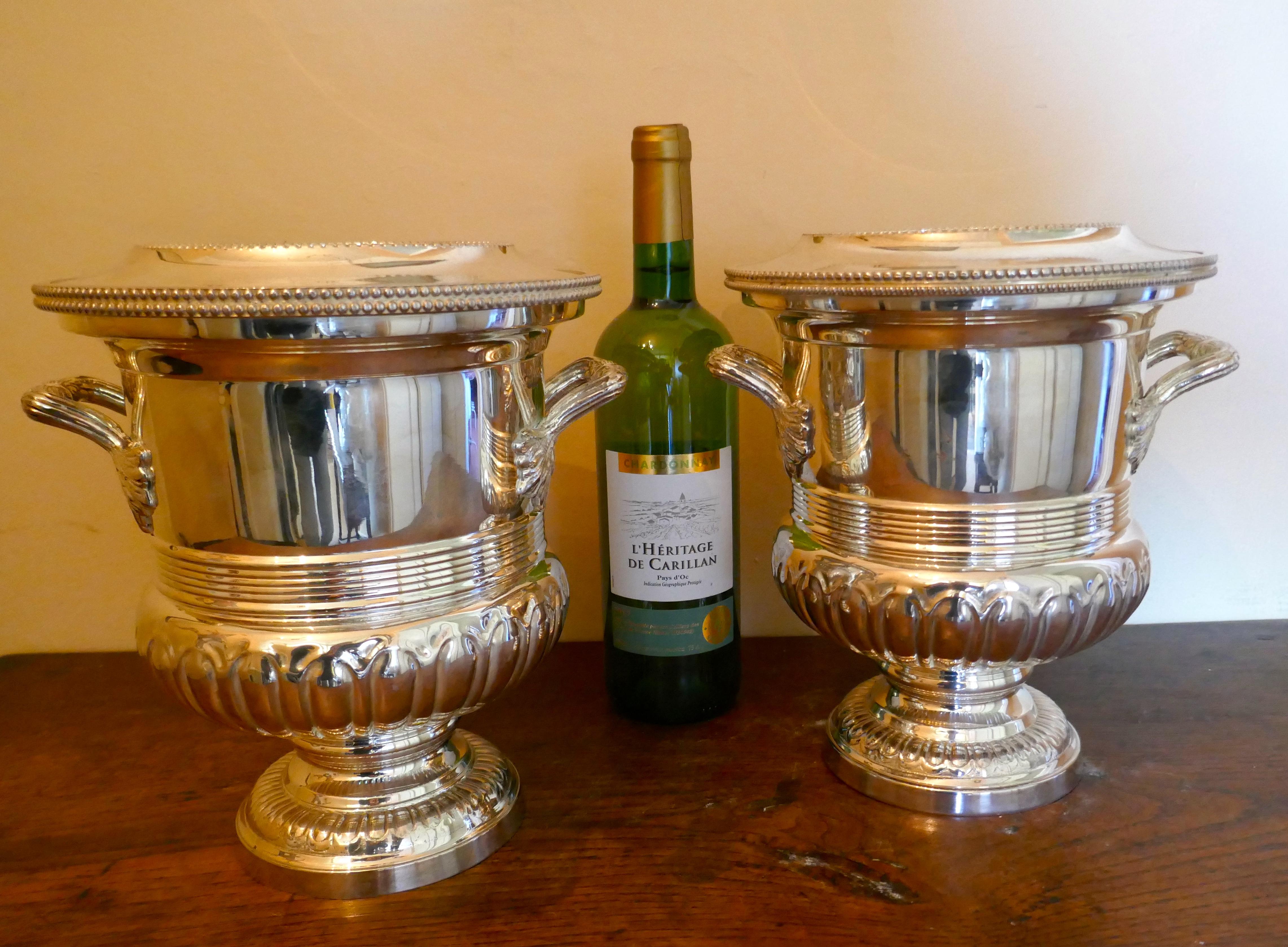 A fine pair of Campana style wine coolers, champagne ice buckets

A very attractive pair of vintage ice buckets complete with removable interior liners
The wine coolers are in heavy quality silver plate and have not seen much use, they are such
