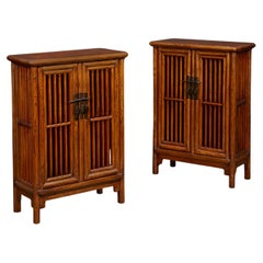 A Fine Pair of Chinese Elm Lattice Cabinets